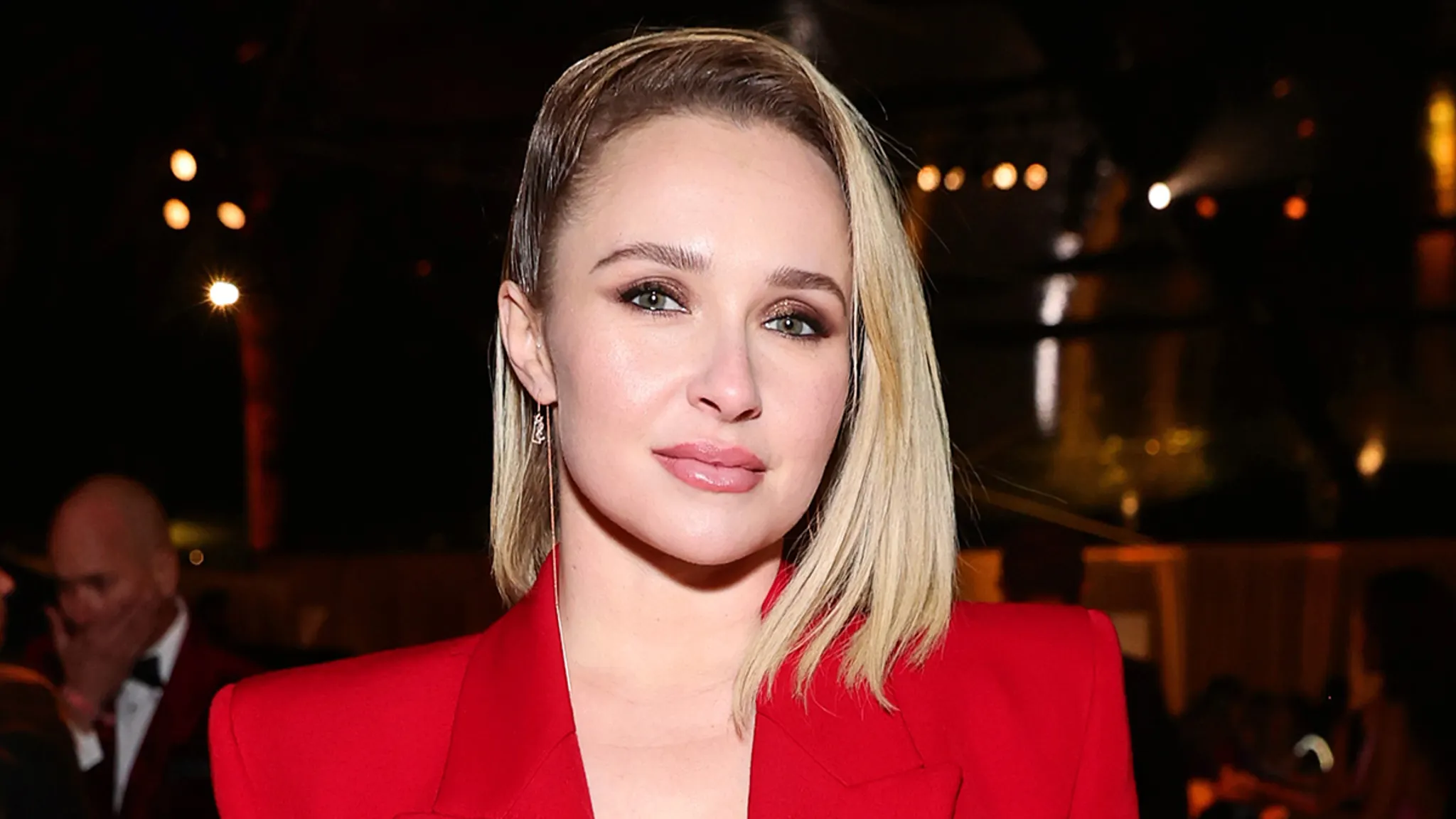 Hayden Panettiere looking toward the camera at a public event.