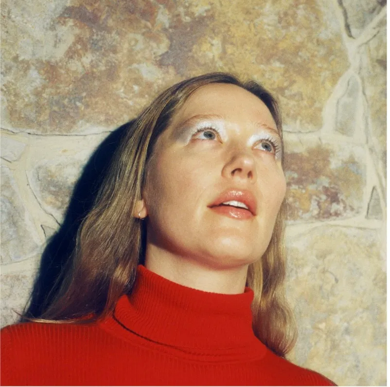 Julia Jacklin performing on a skyscraper roof in Melbourne