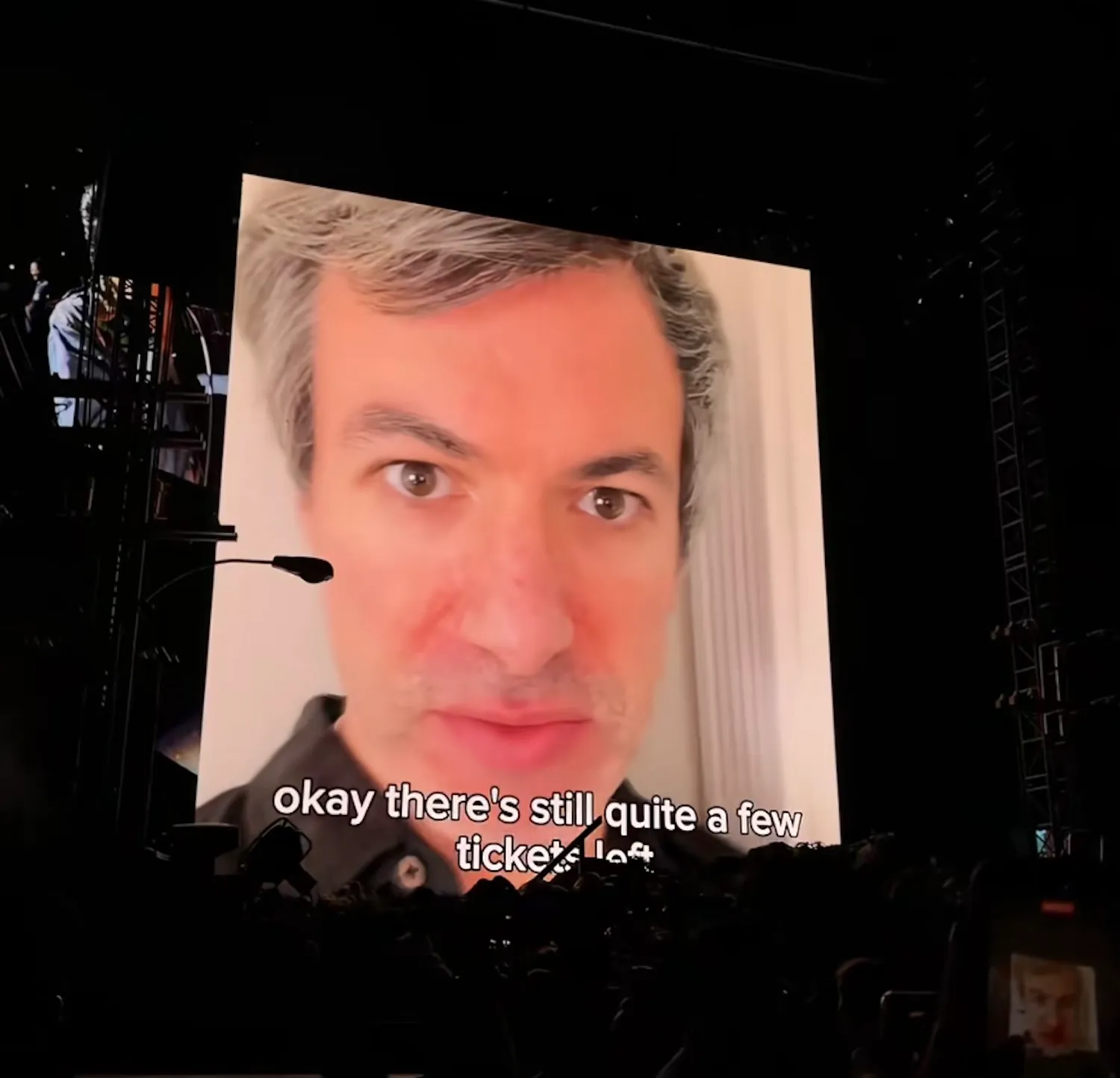 Nathan Fielder taking the microphone onstage during Noah Kahan's Vancouver concert