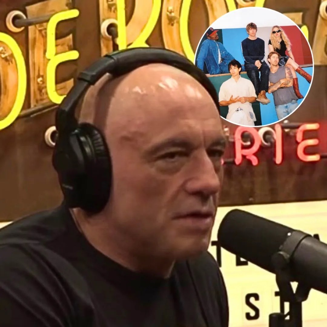 Joe Rogan wearing headphones in his podcast studio while speaking into a microphone
