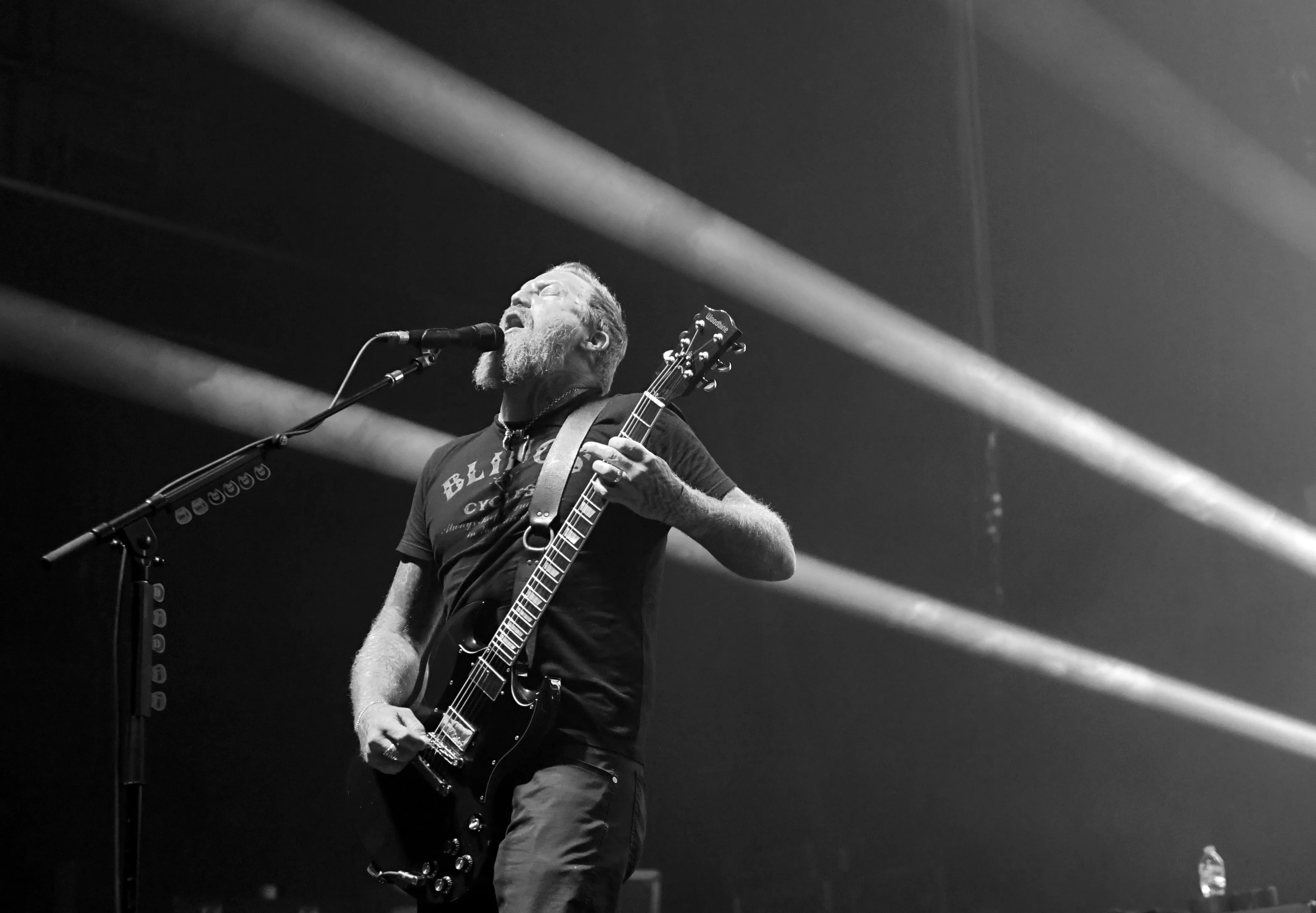 Brent Hinds performing live on stage with heavy metal band Mastodon