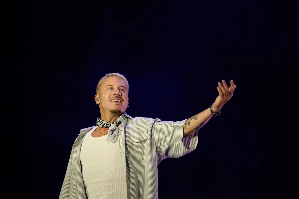 Macklemore performing on stage during a concert tour stop