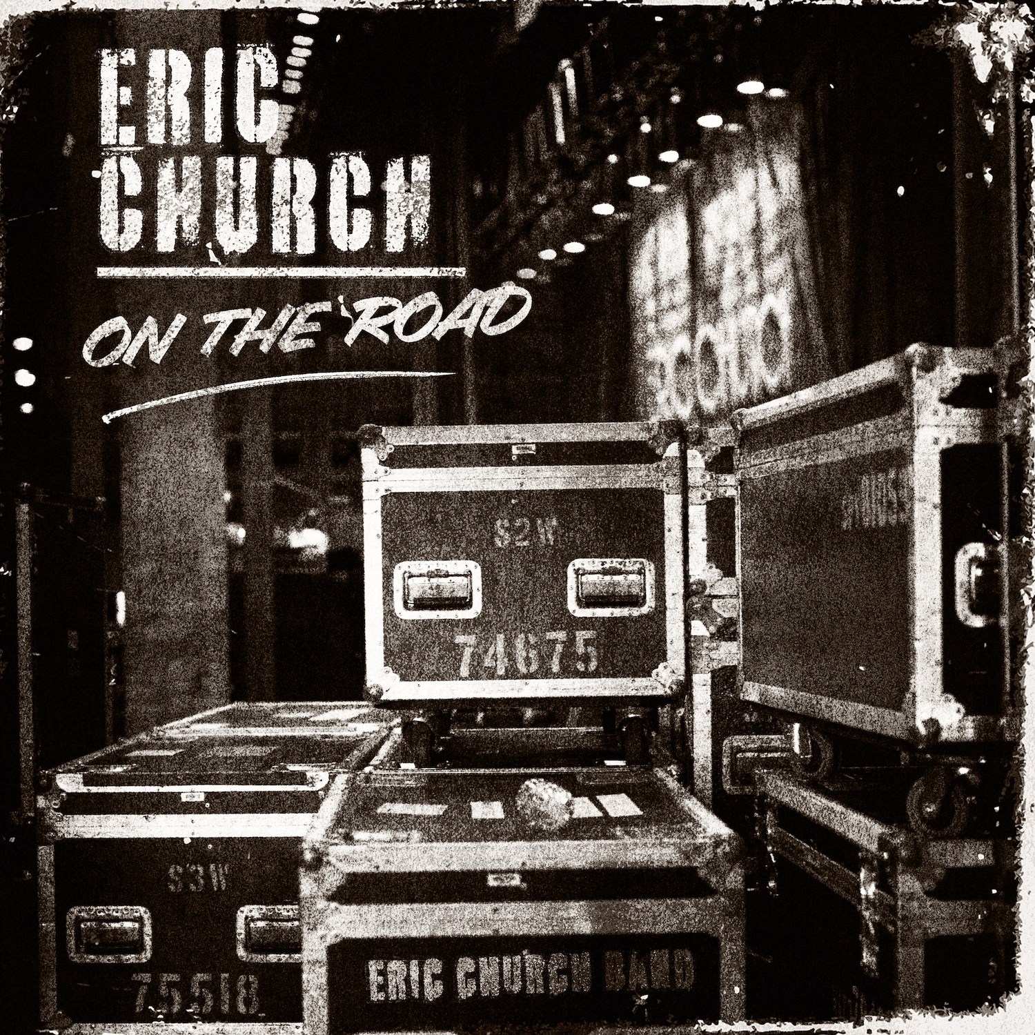 Country star Eric Church wearing his signature aviator sunglasses while performing live on stage.