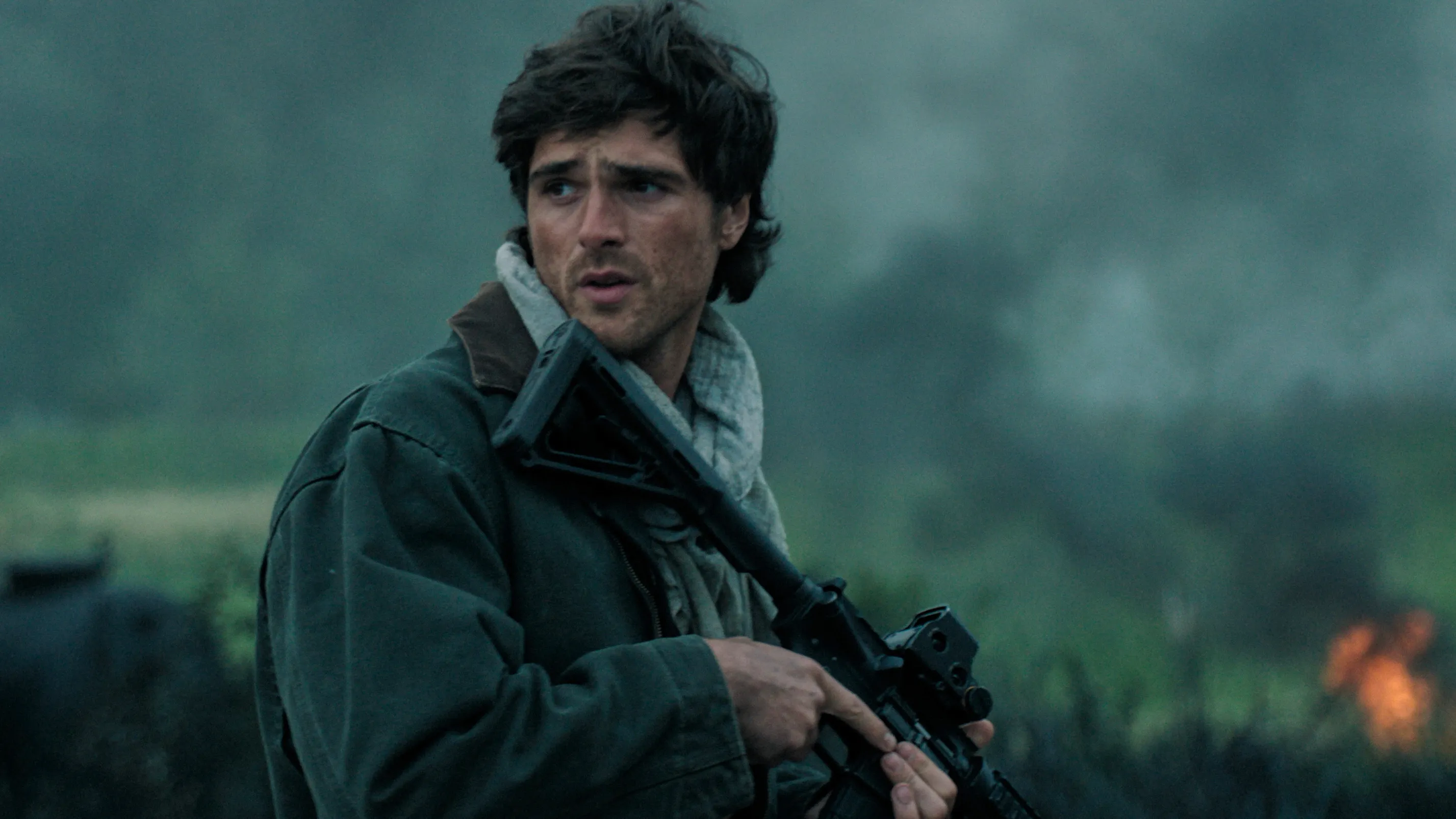 Jacob Elordi holding a rifle in a scene from "The Dog Stars."