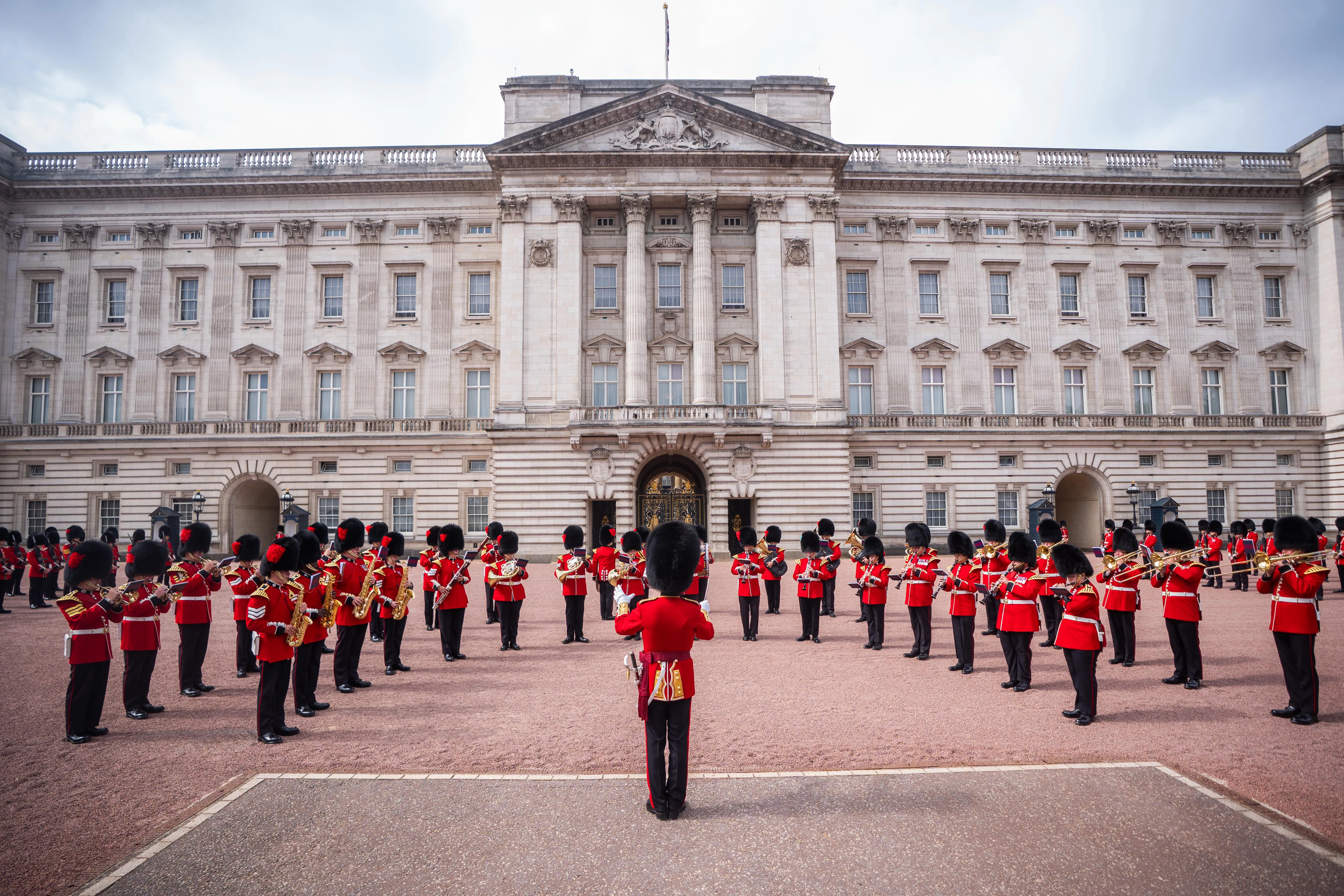 A marching band of Coldstream Guards and Welsh Guards playing tribute to Dolly Parton during the Changing the Guard at Buckingham Palace.