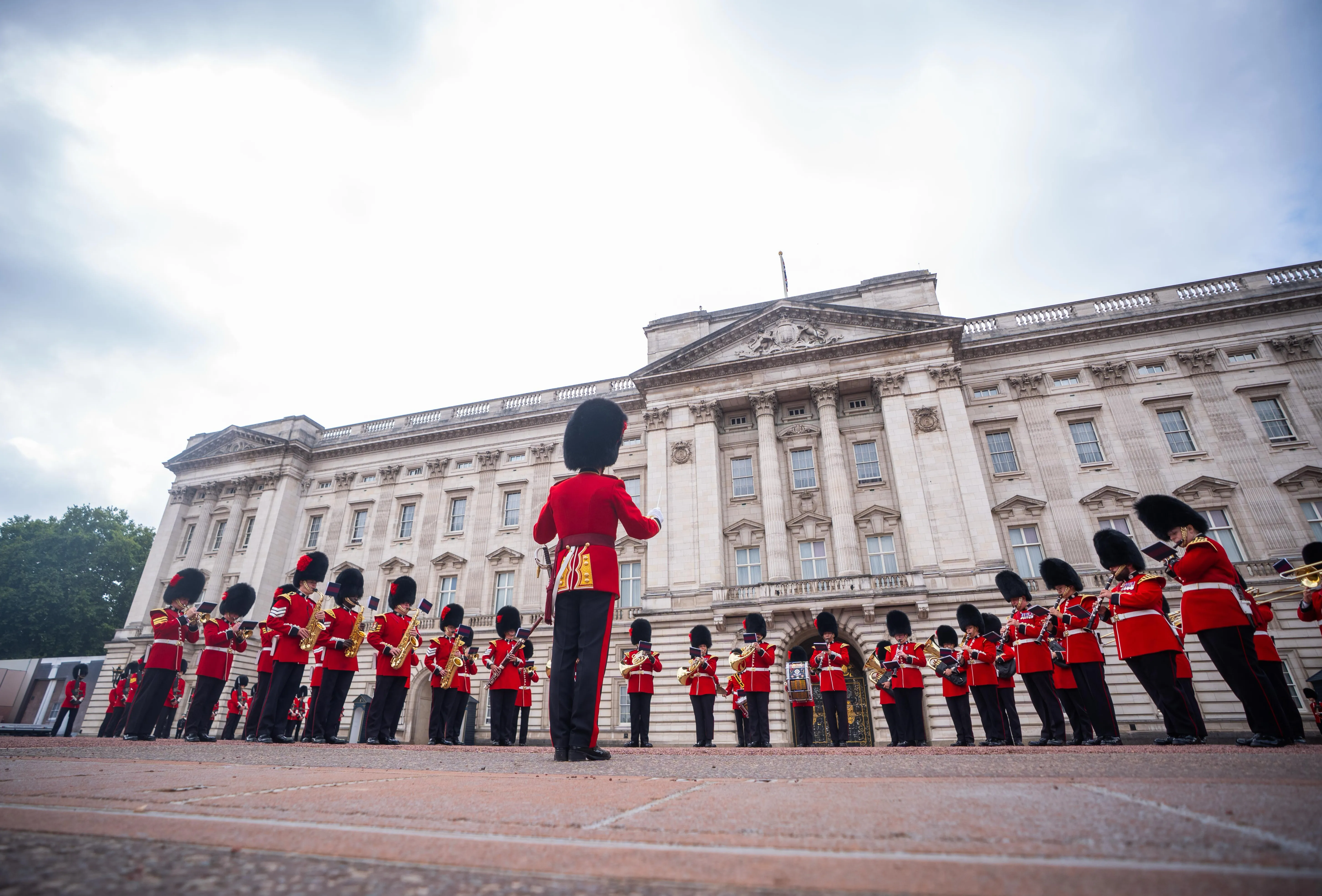 The Coldstream Guards and Welsh Guards band perform a tribute to Dolly Parton during the Changing of the Guard at Buckingham Palace.