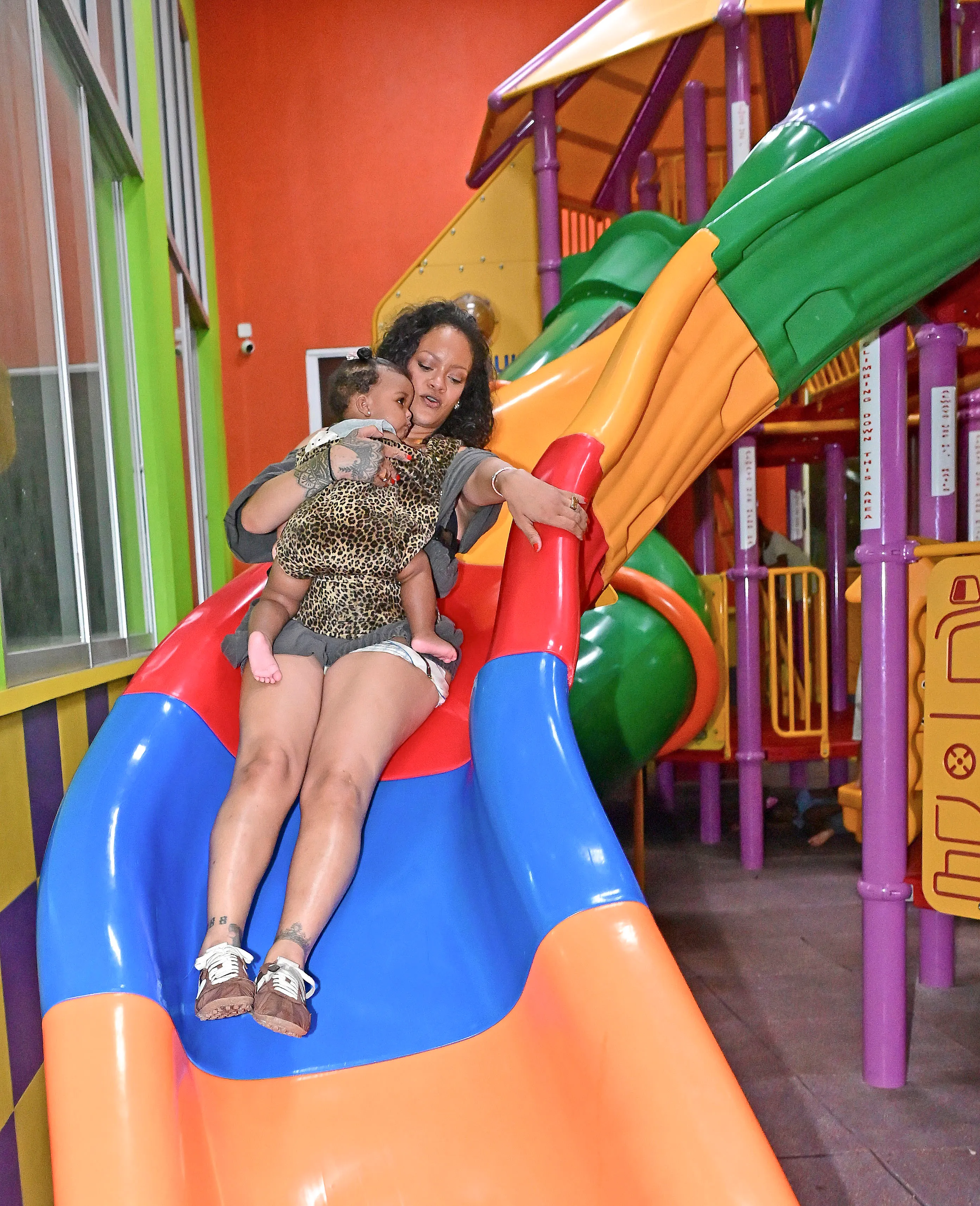 Rihanna brings her three children, RZA, Riot, and baby daughter Rocki, to the playground she once visited as a child growing up in Barbados.