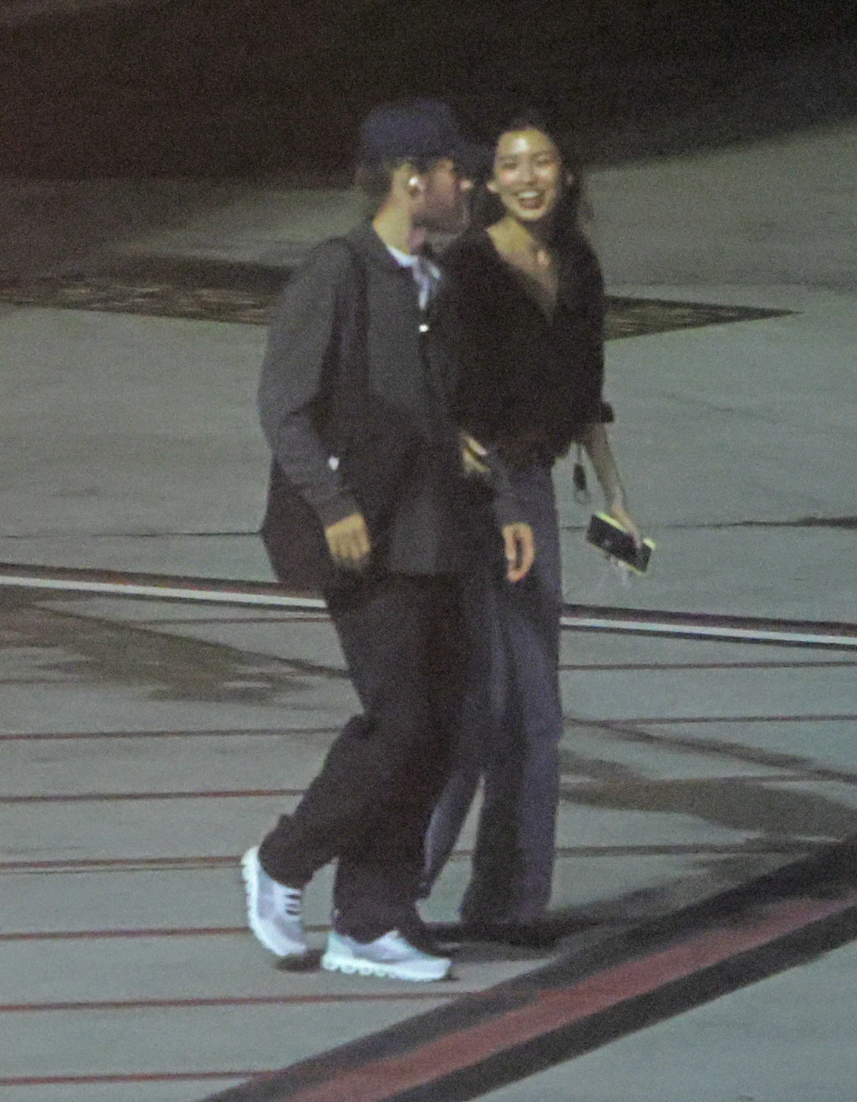 Jared Leto and Thet Thinn walking at LAX.