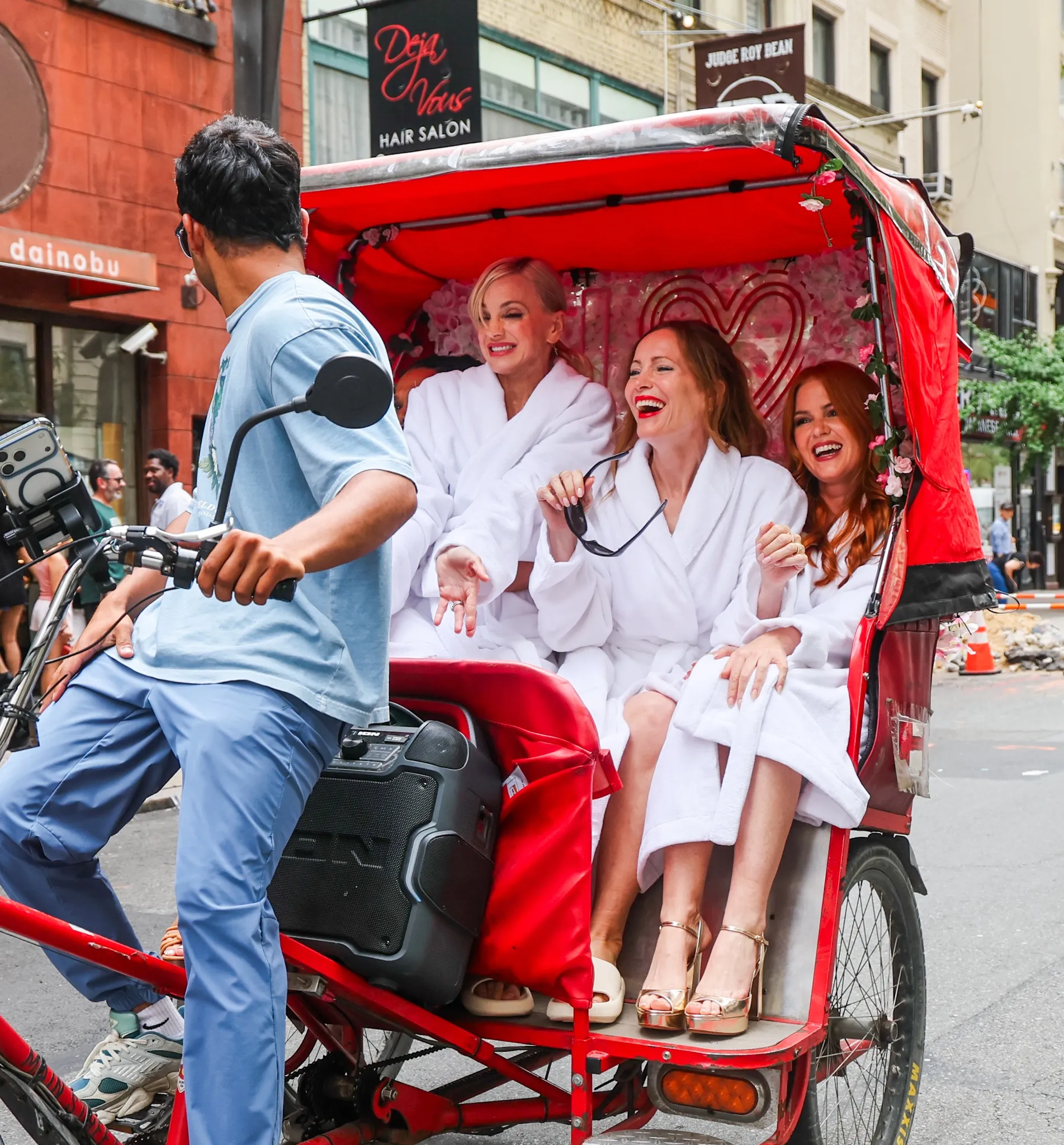 Isla Fisher, Leslie Mann, Michelle Buteau and Anna Faris were seen in white robes while filming a promo for their new movie "Spa Weekend" in NYC.