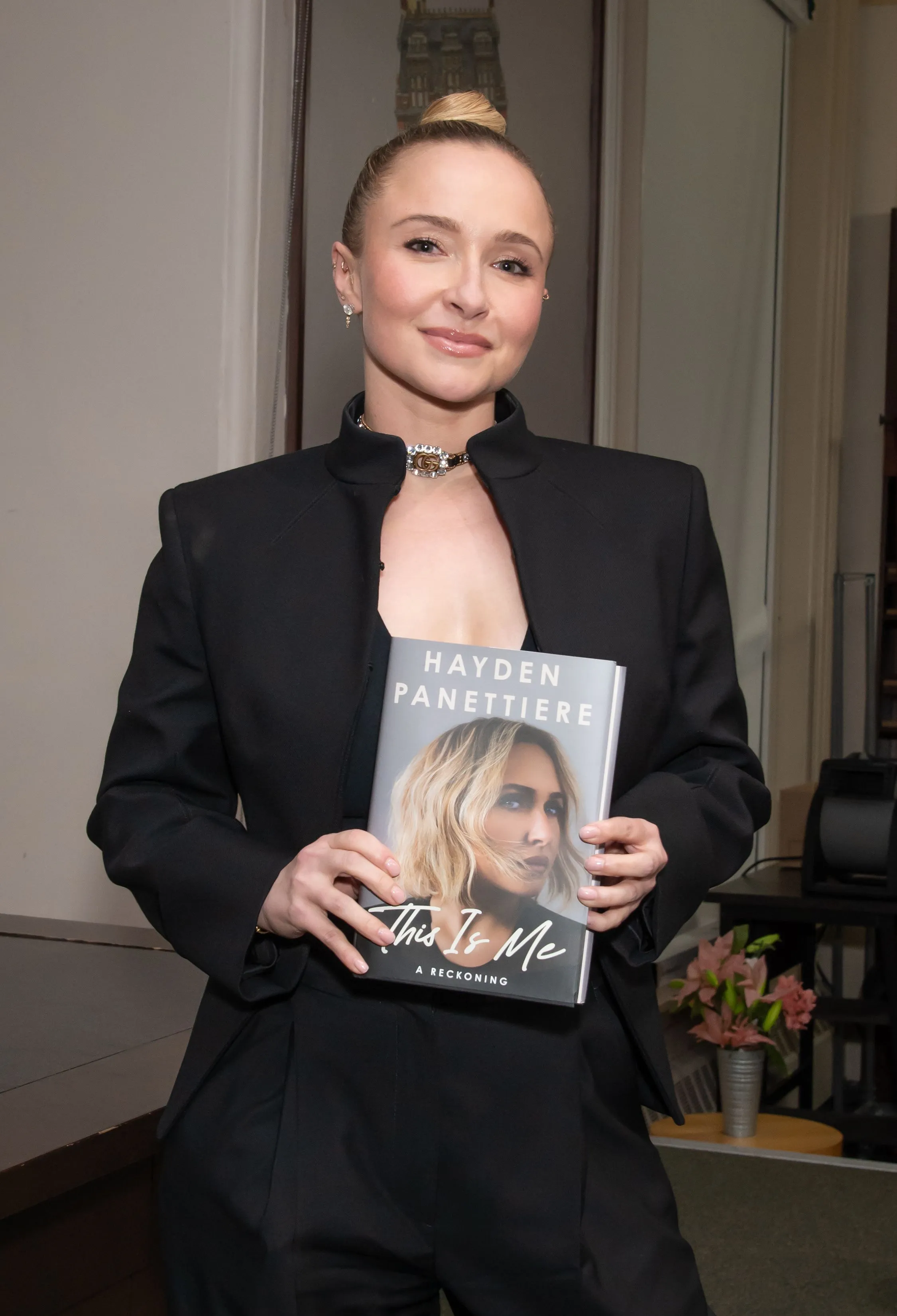 Hayden Panettiere holds her memoir "This Is Me A Reckoning."