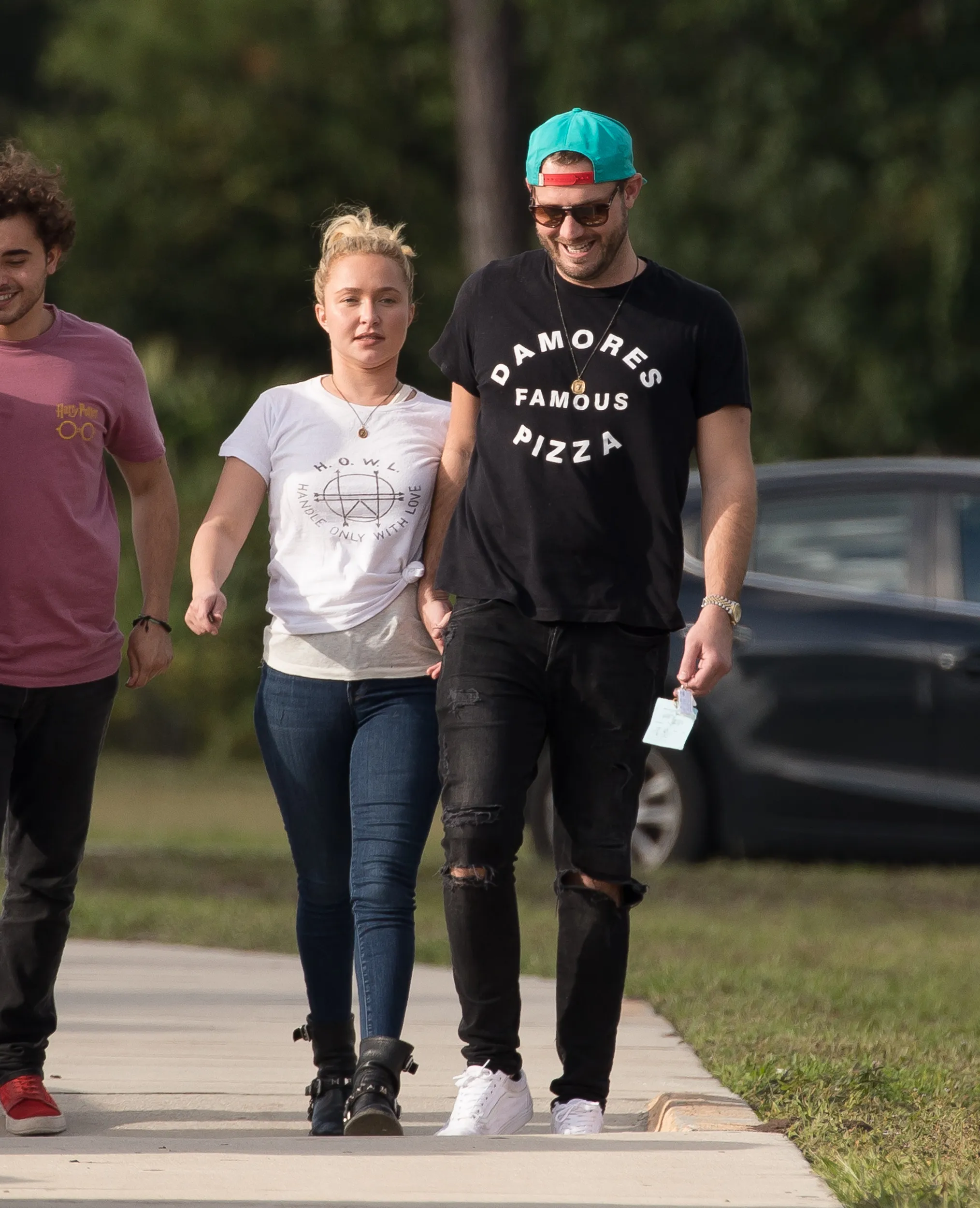 Hayden Panettiere and Brian Hickerson holding hands, with Panettiere