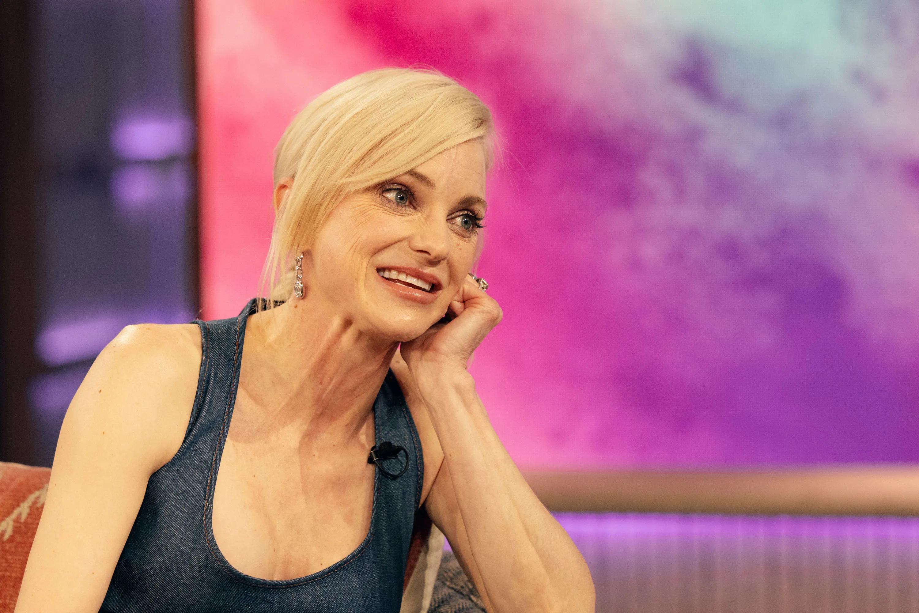 Anna Faris smiling and listening during an interview on The Kelly Clarkson Show.