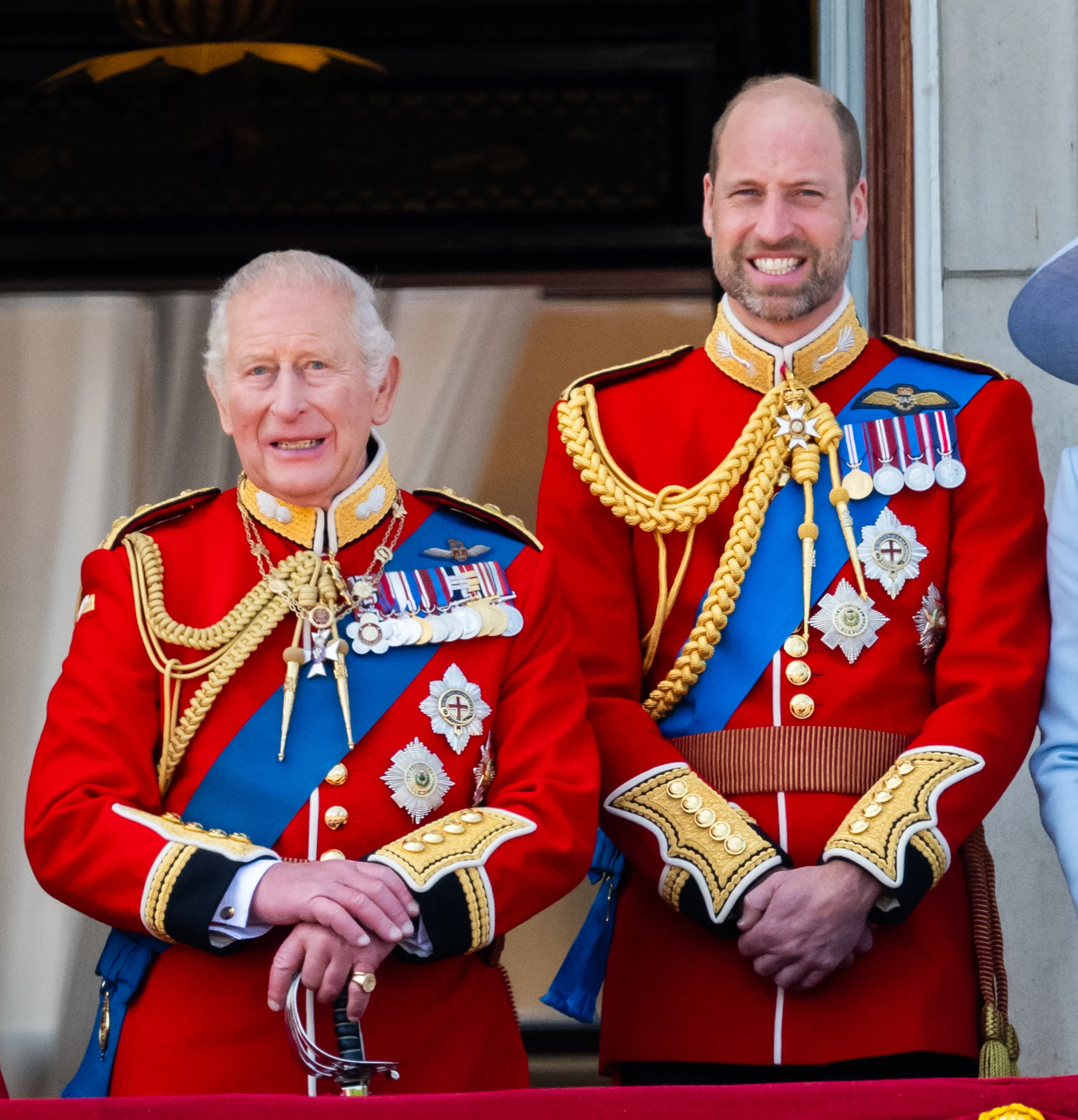 King Charles III and Prince William on the balcony of Buckingham Palace.