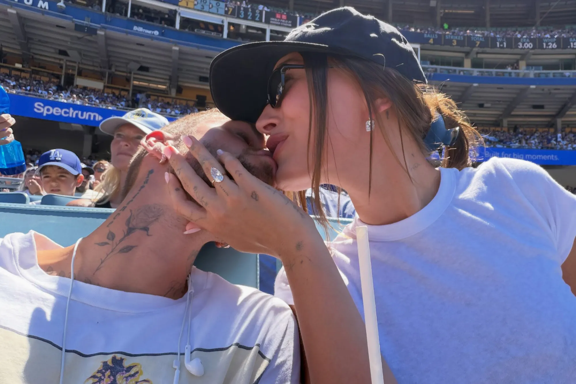 Justin Bieber and Hailey Bieber sharing a kiss outdoors