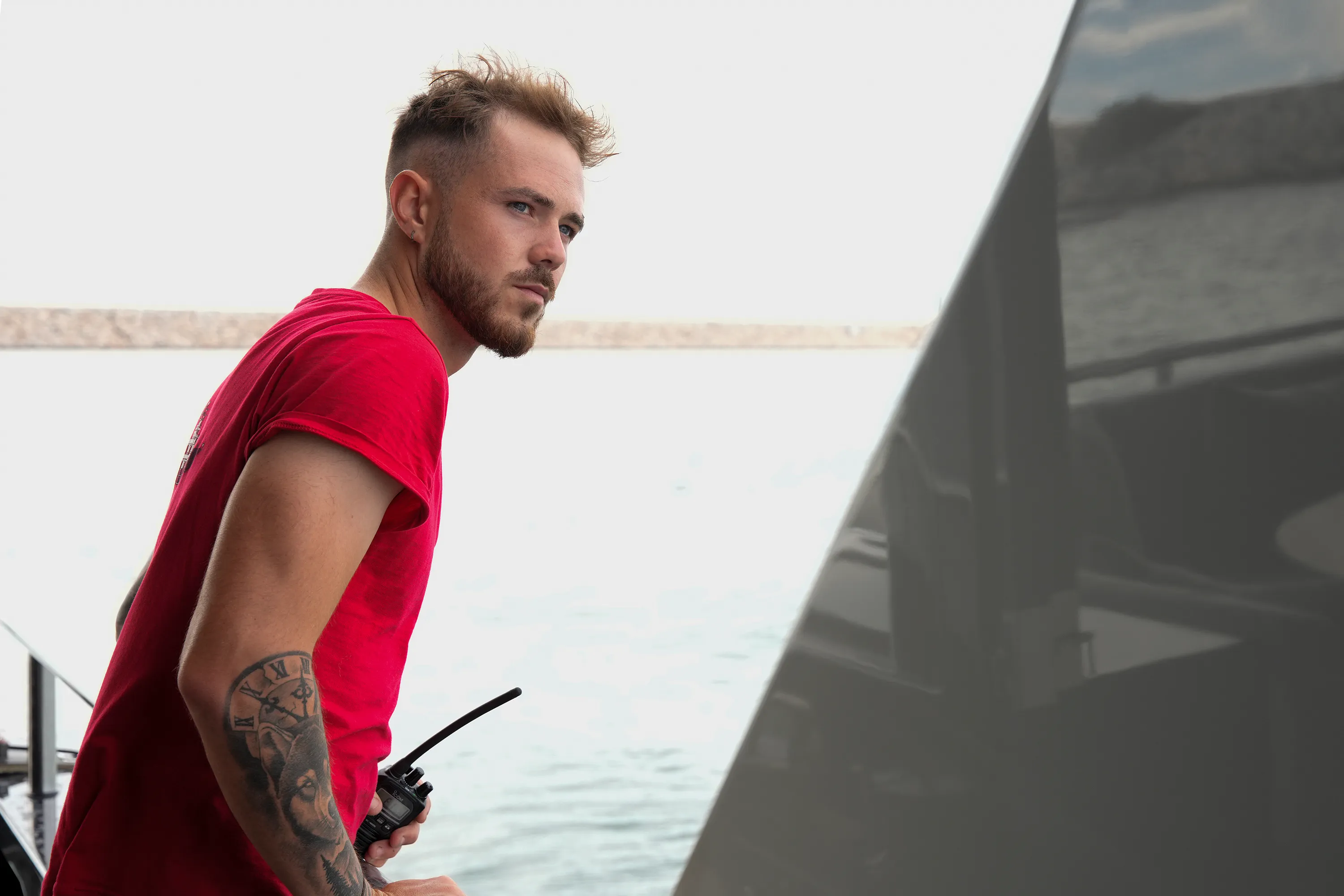 Nathan Gallagher from Below Deck Mediterranean looks out over the water.