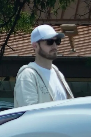 Brian Hickerson wearing a white hat and sunglasses.