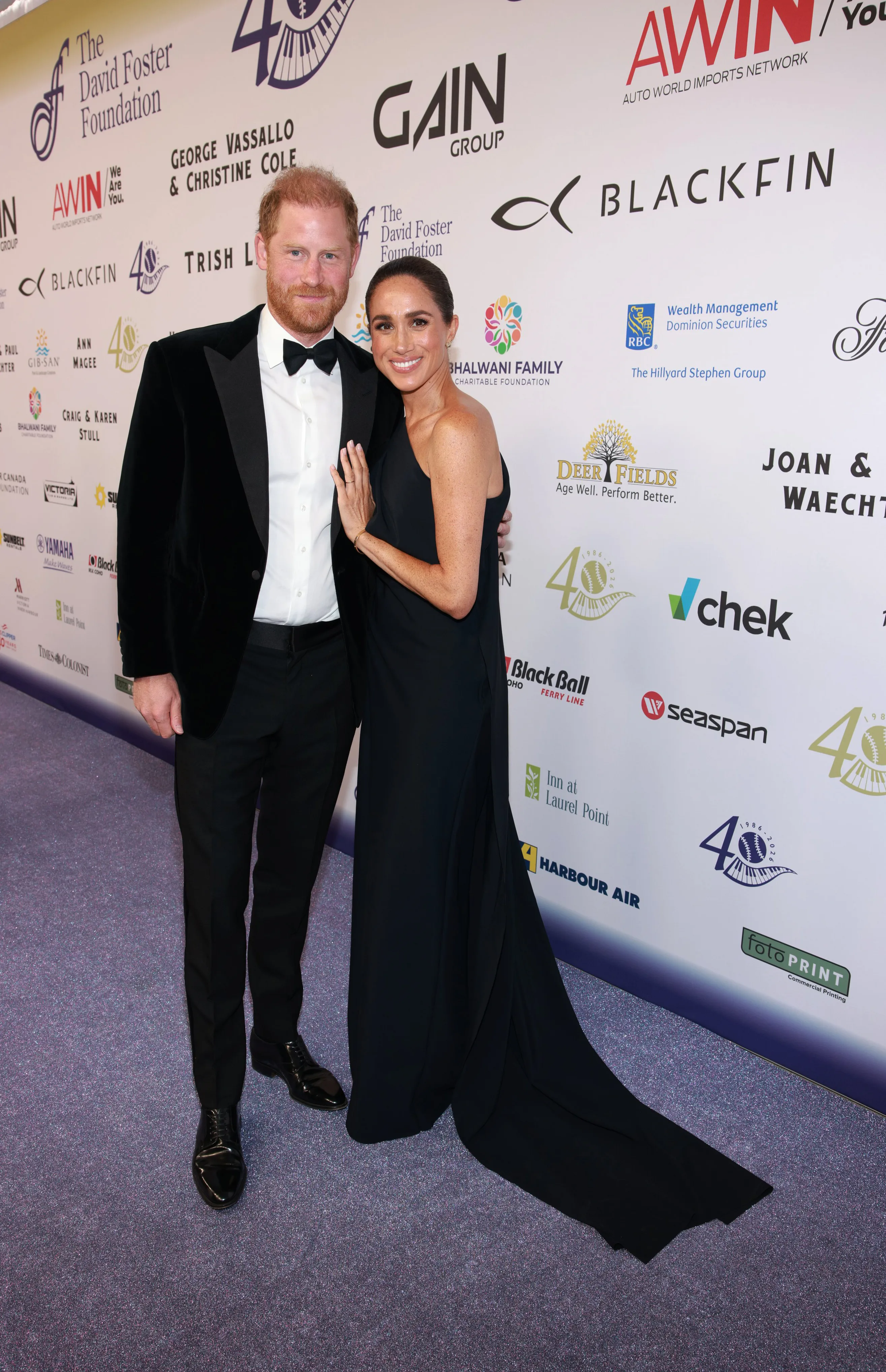 Prince Harry and Meghan, Duchess of Sussex, pose for a photo at the David Foster Foundation 40th Anniversary Celebration.