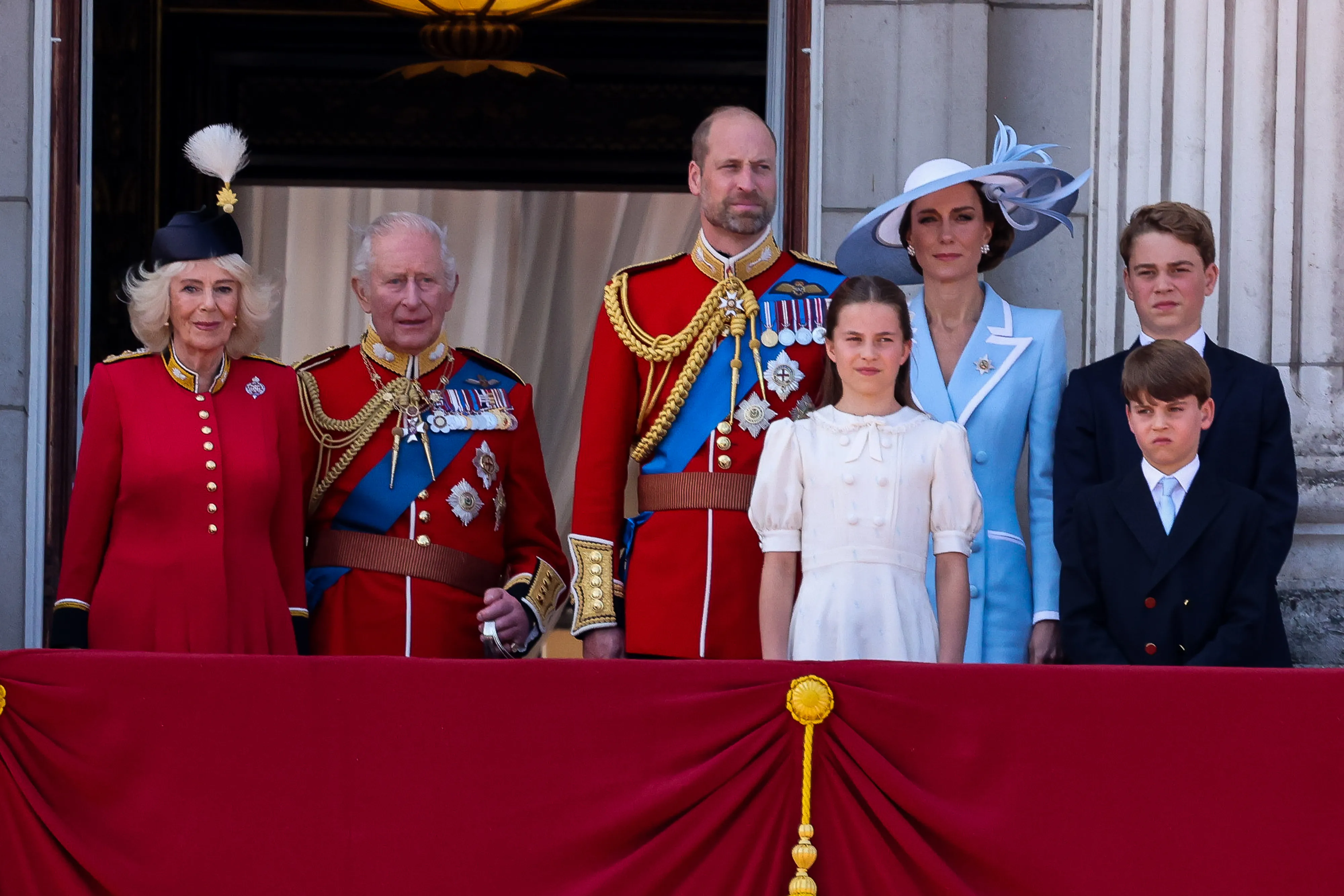 Queen Camilla, King Charles III, Prince William, Catherine, Princess of Wales, Princess Charlotte, Prince Louis, and Prince George on the Buckingham Palace balcony.
