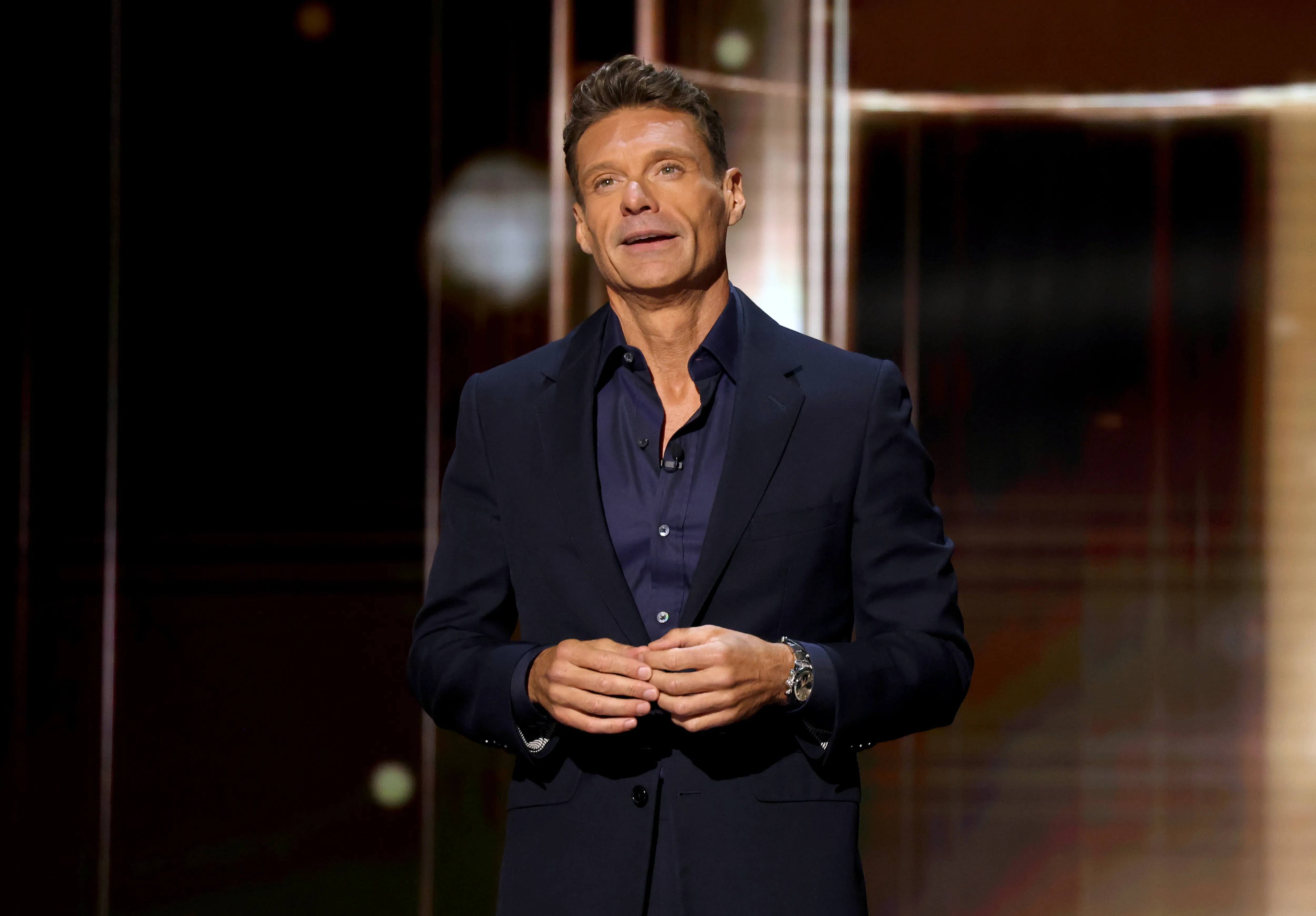 Ryan Seacrest speaks onstage at the Disney Entertainment Showcase.