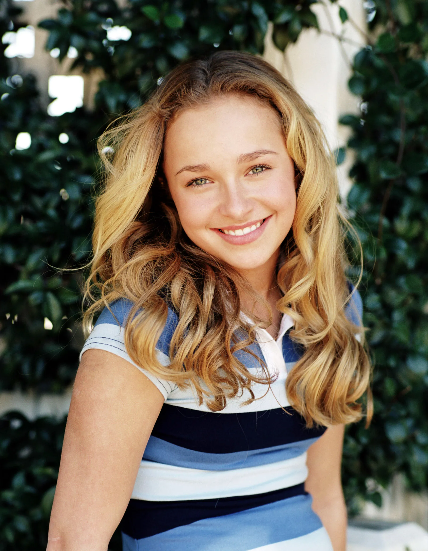 Hayden Panettiere in a striped shirt, smiling.