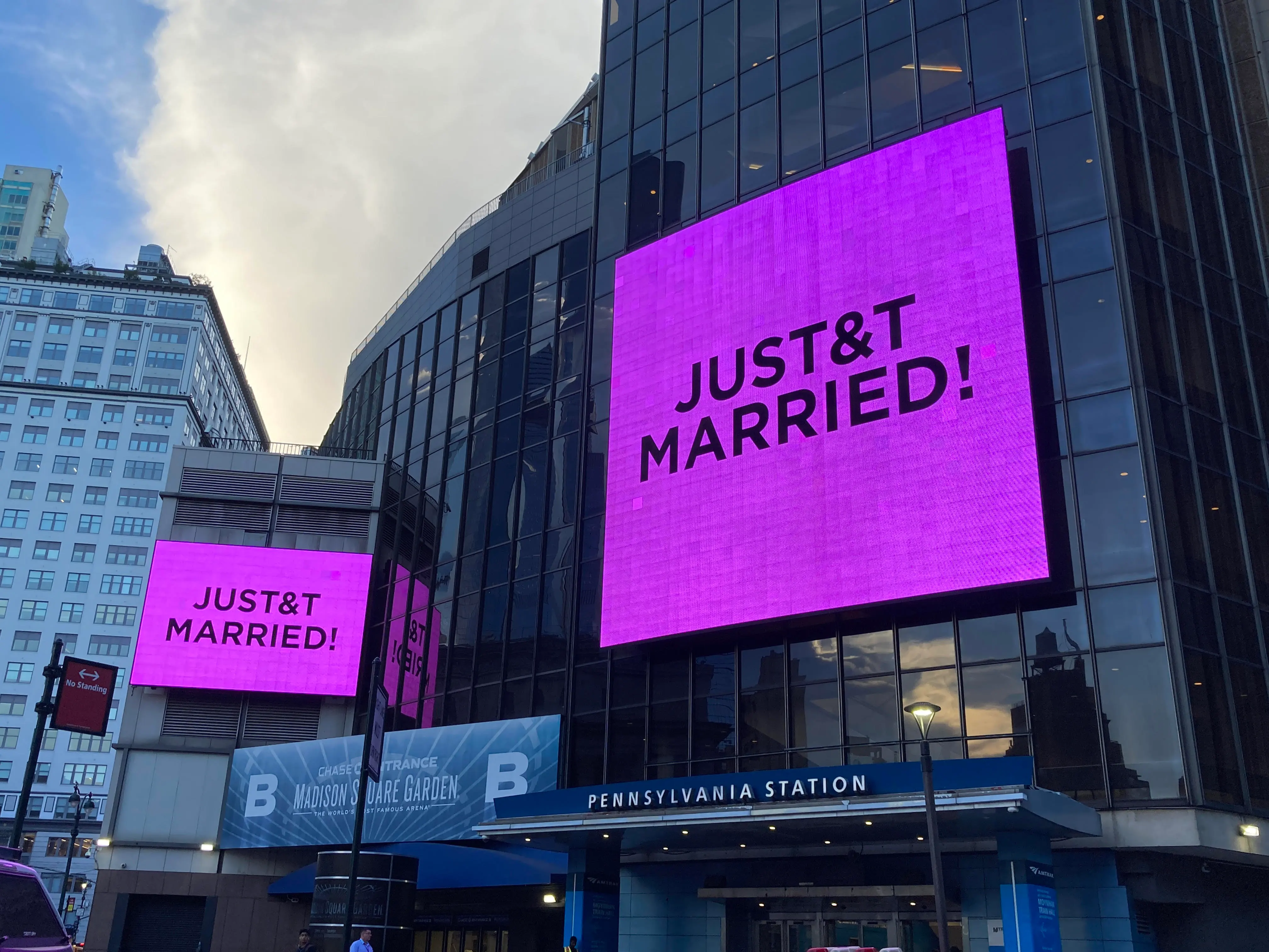 Signs reading "JUST&T MARRIED!" illuminate outside Madison Square Garden.