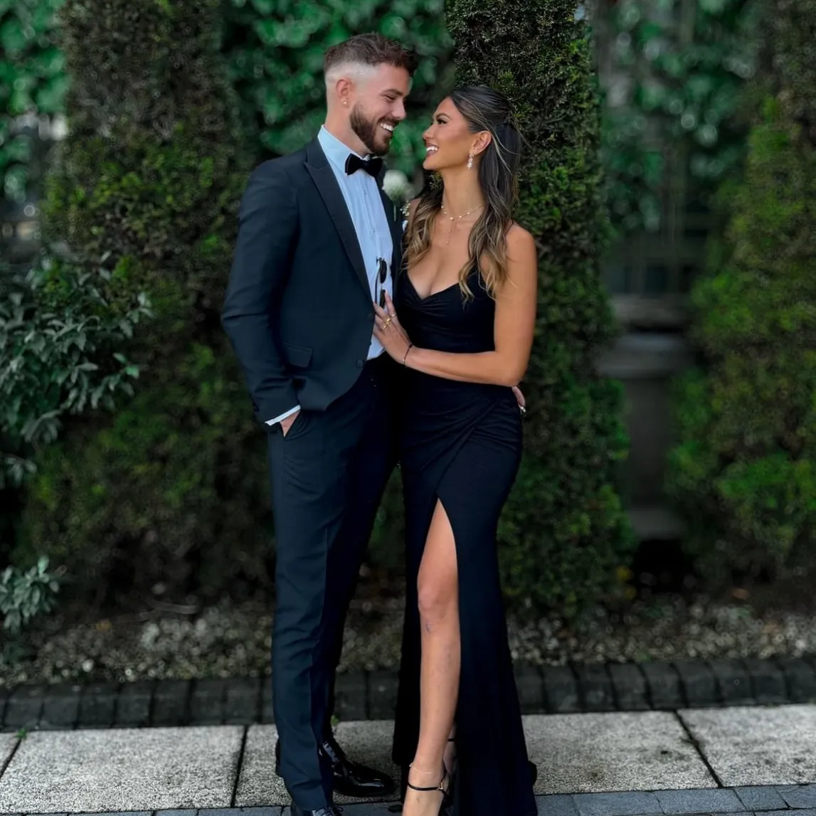 Nathan Gallagher from Below Deck Med and a woman pose together in formal wear.