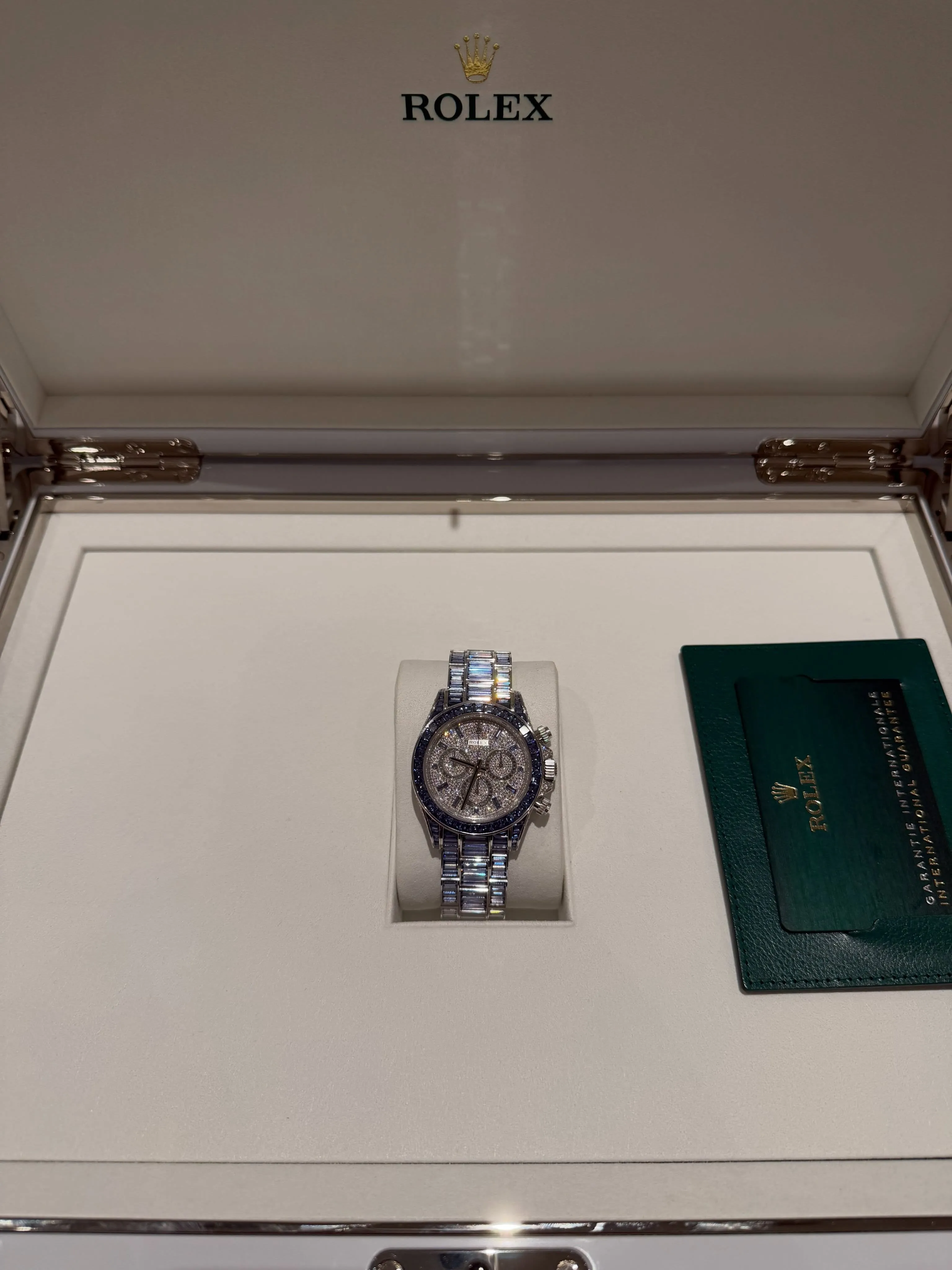 A Drake Rolex watch with a jeweled band and face.