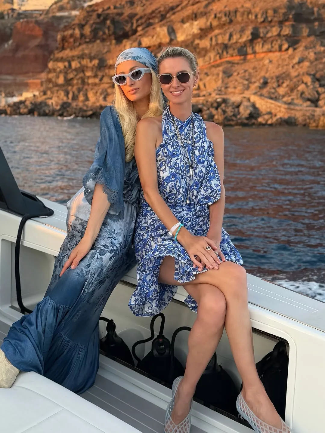 Sisters Paris (left) and Nicky Hilton spend some family time on their Greek vacation.