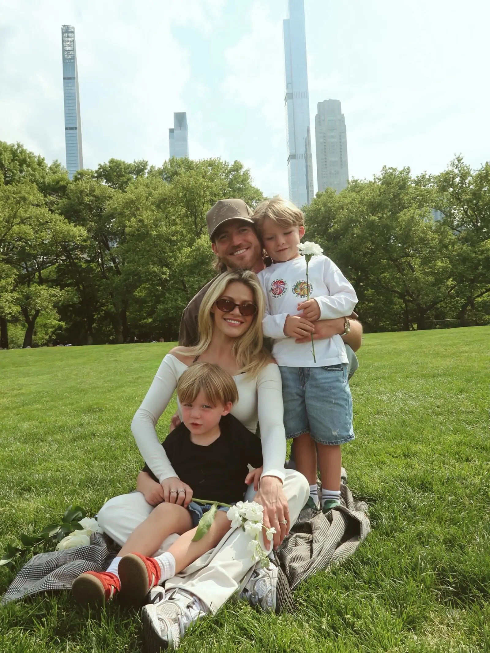 Witney Carson with her family in a park.