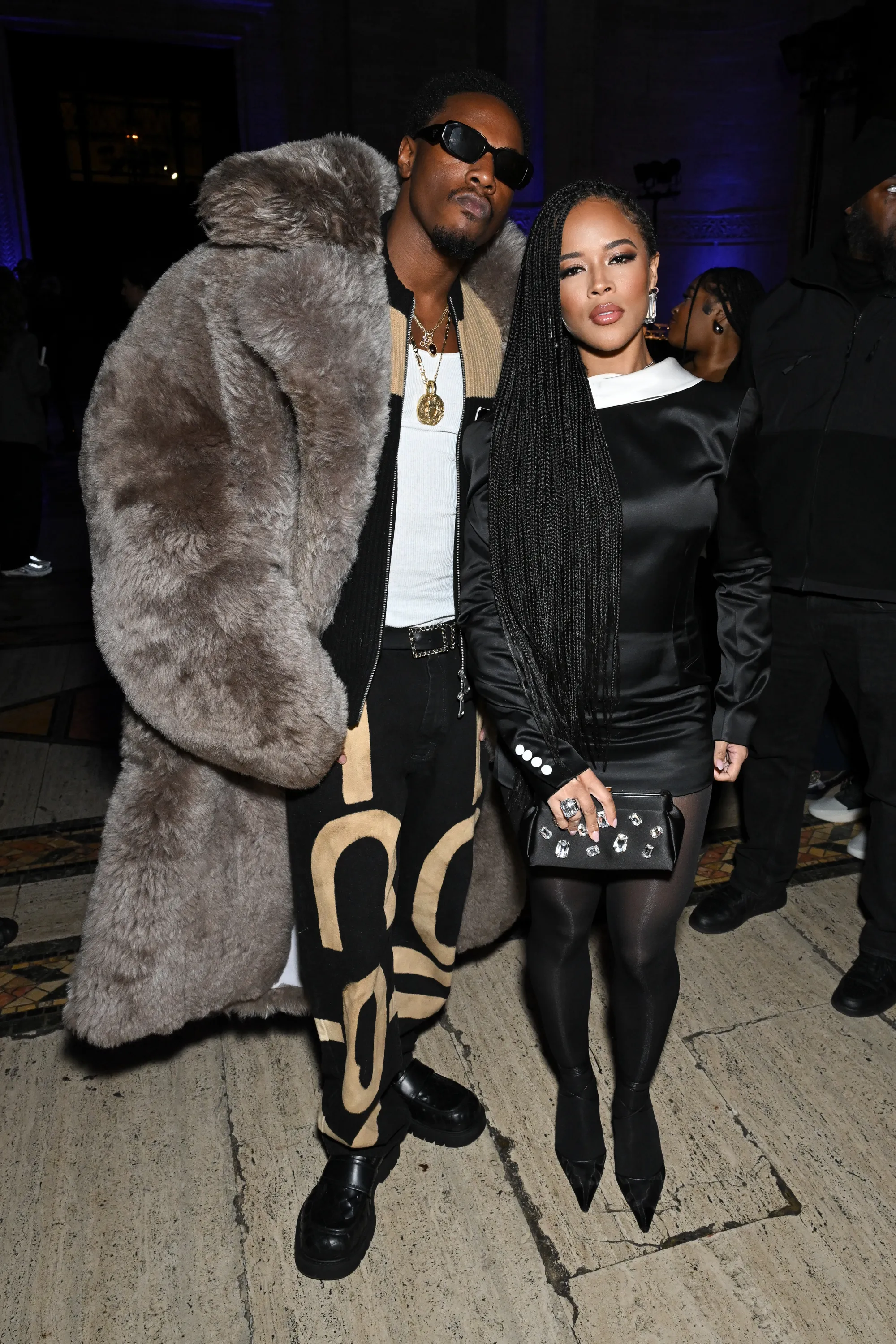 Joey Bada$$ and Serayah McNeill posing for a photo.