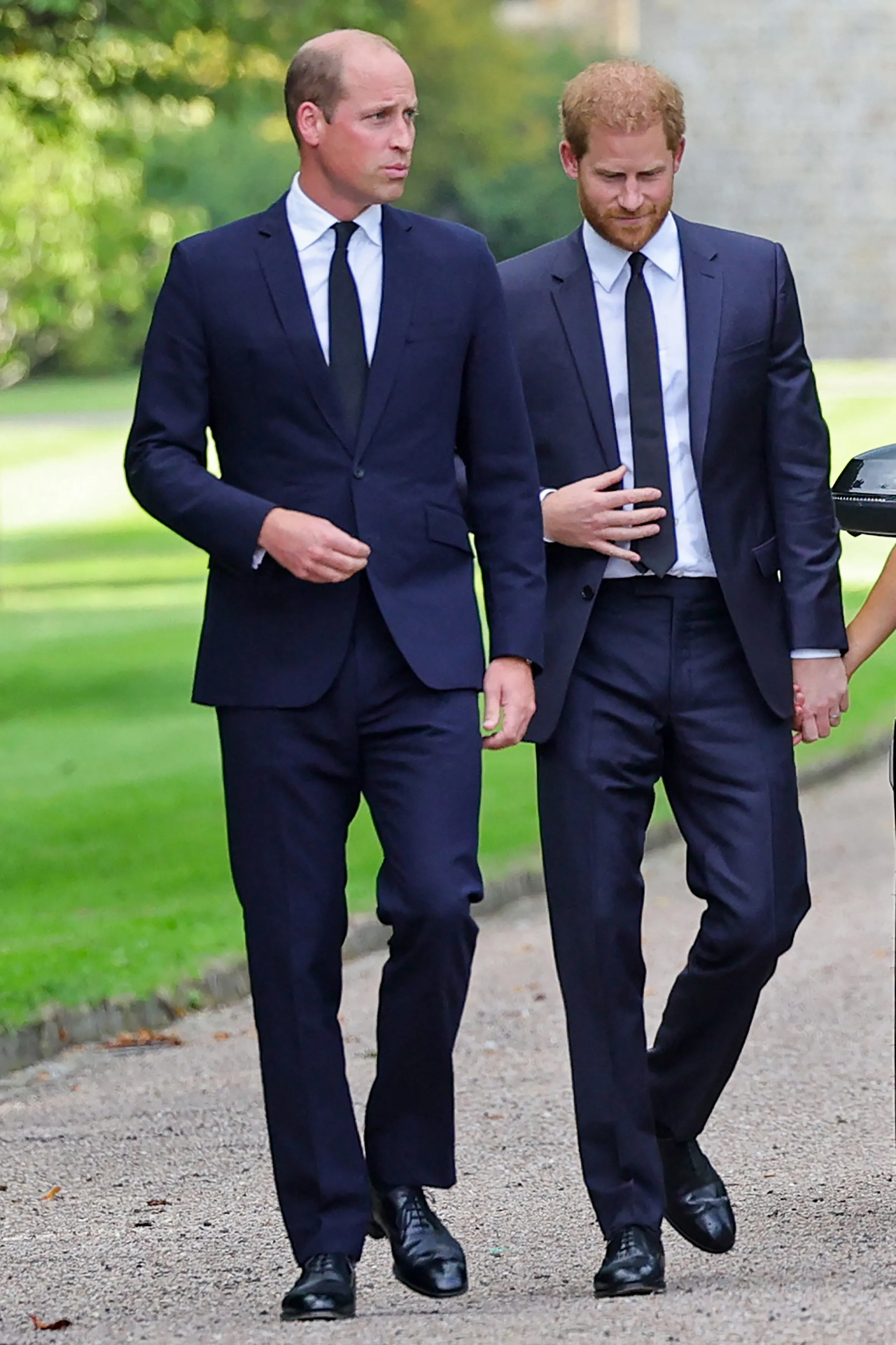 Prince William and Prince Harry walking together at Windsor Castle.