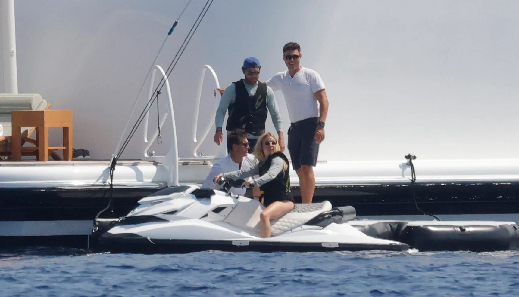 Sydney Sweeney on a jet ski with Scooter Braun and friends on a superyacht in Mallorca.