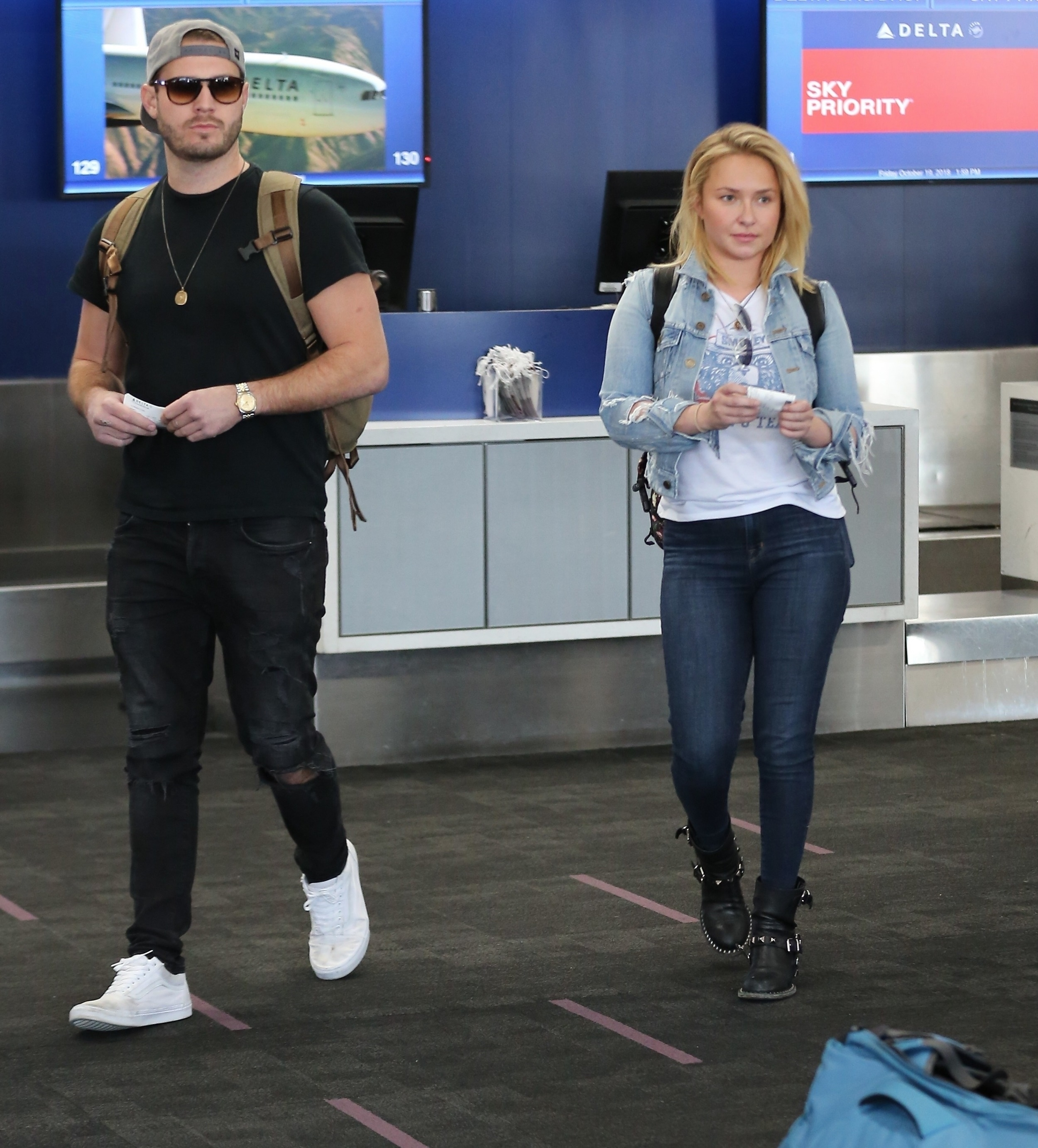 Brian Hickerson and Hayden Panettiere walking through LAX Airport.