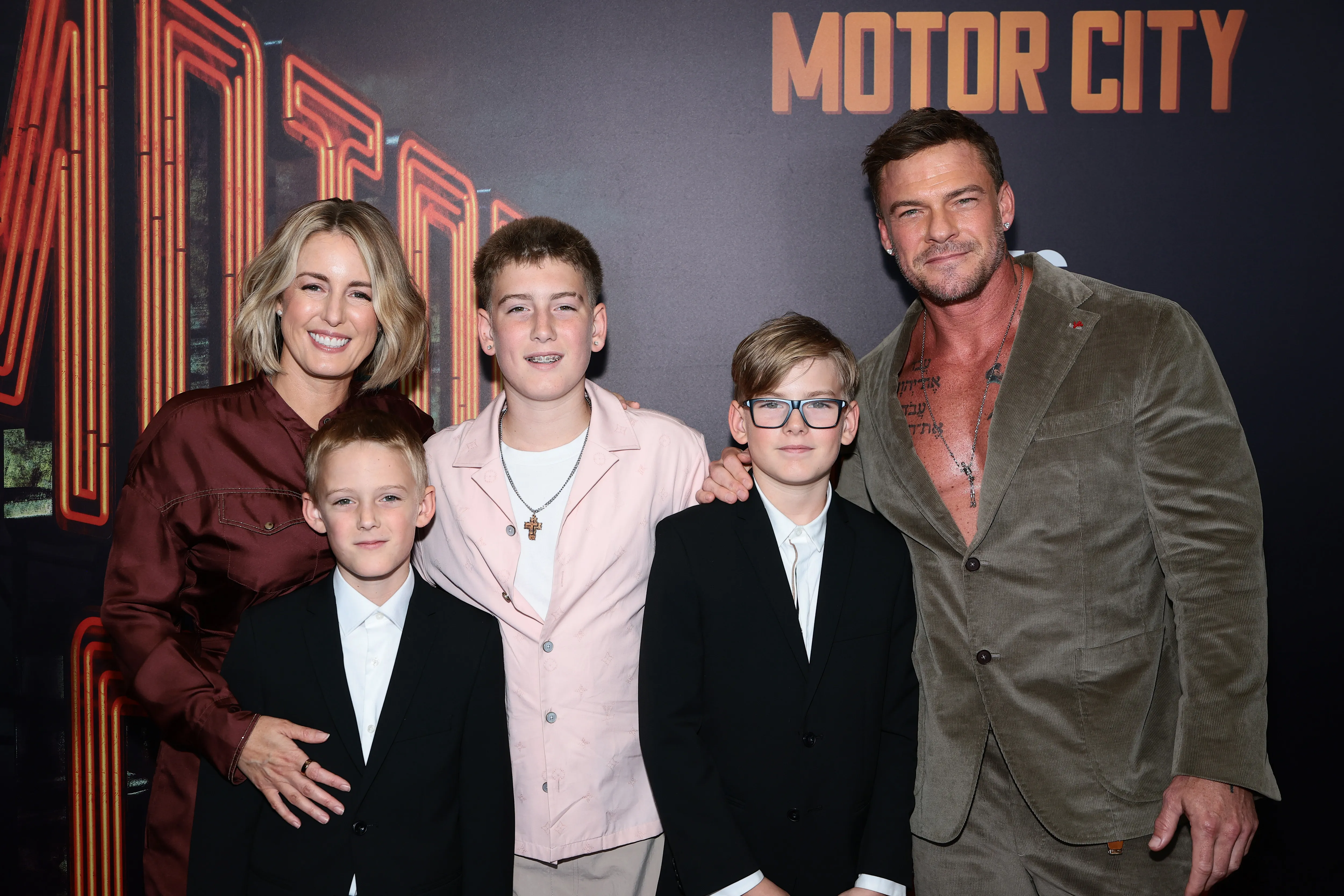 Catherine Ritchson and Alan Ritchson with their three children at the premiere of "Motor City".