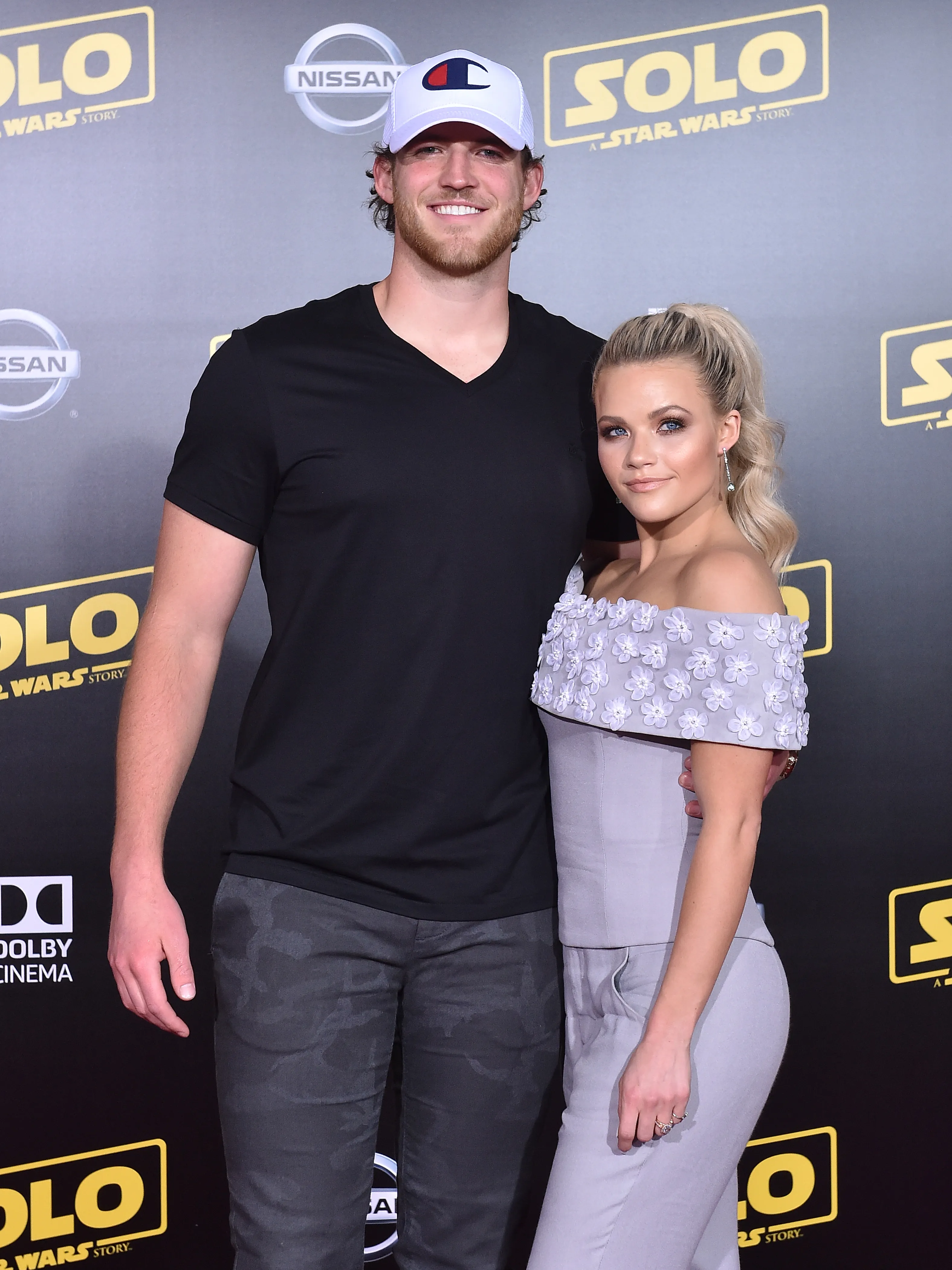 Witney Carson and husband Carson McAllister standing at the premiere of "Solo: A Star Wars Story."
