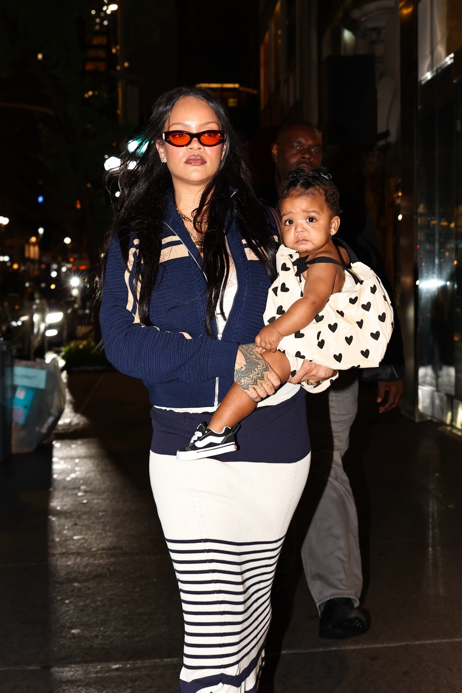 Rihanna holding her baby daughter Rocki while out in New York City.