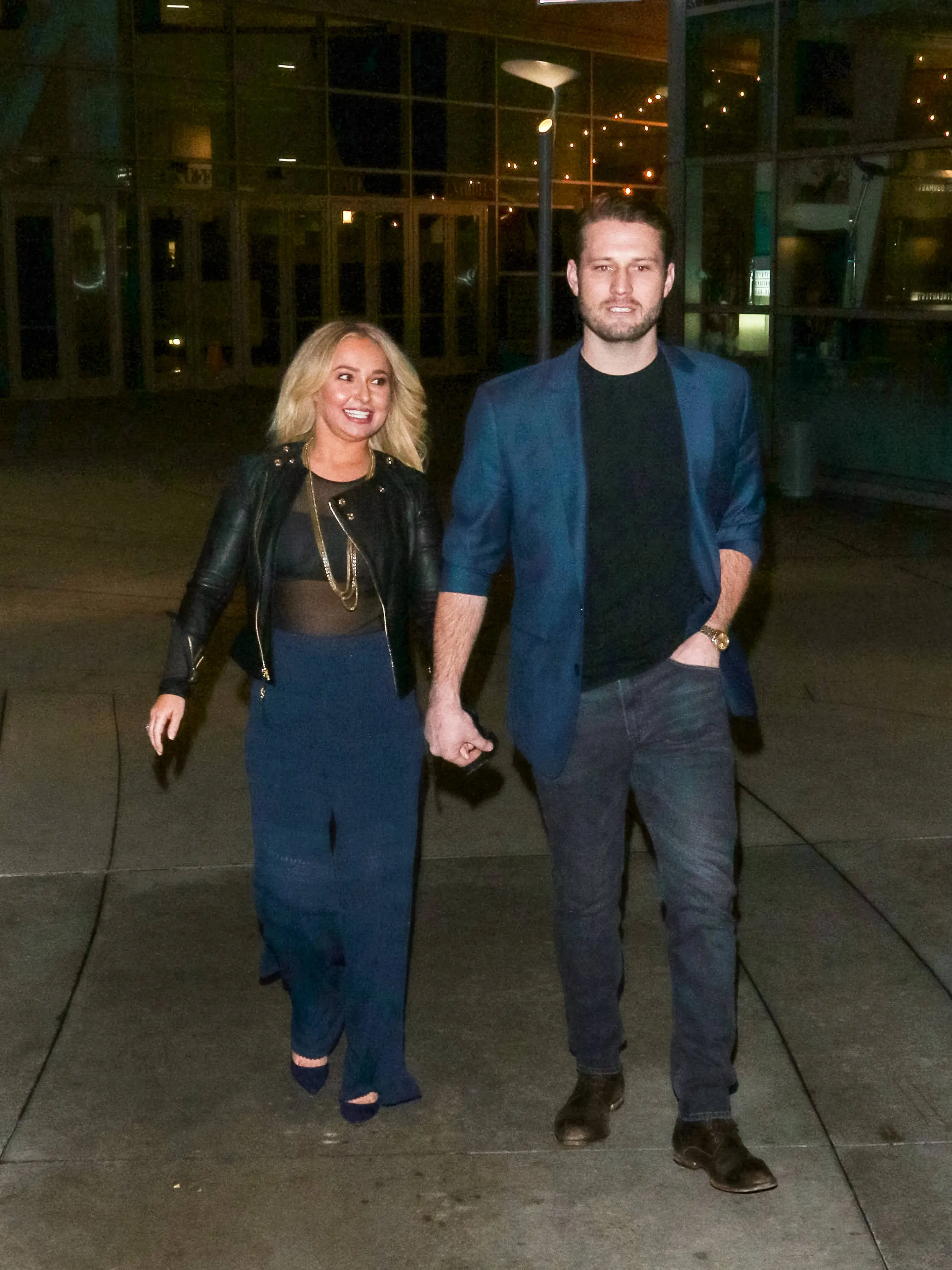 Hayden Panettiere and Brian Hickerson holding hands.