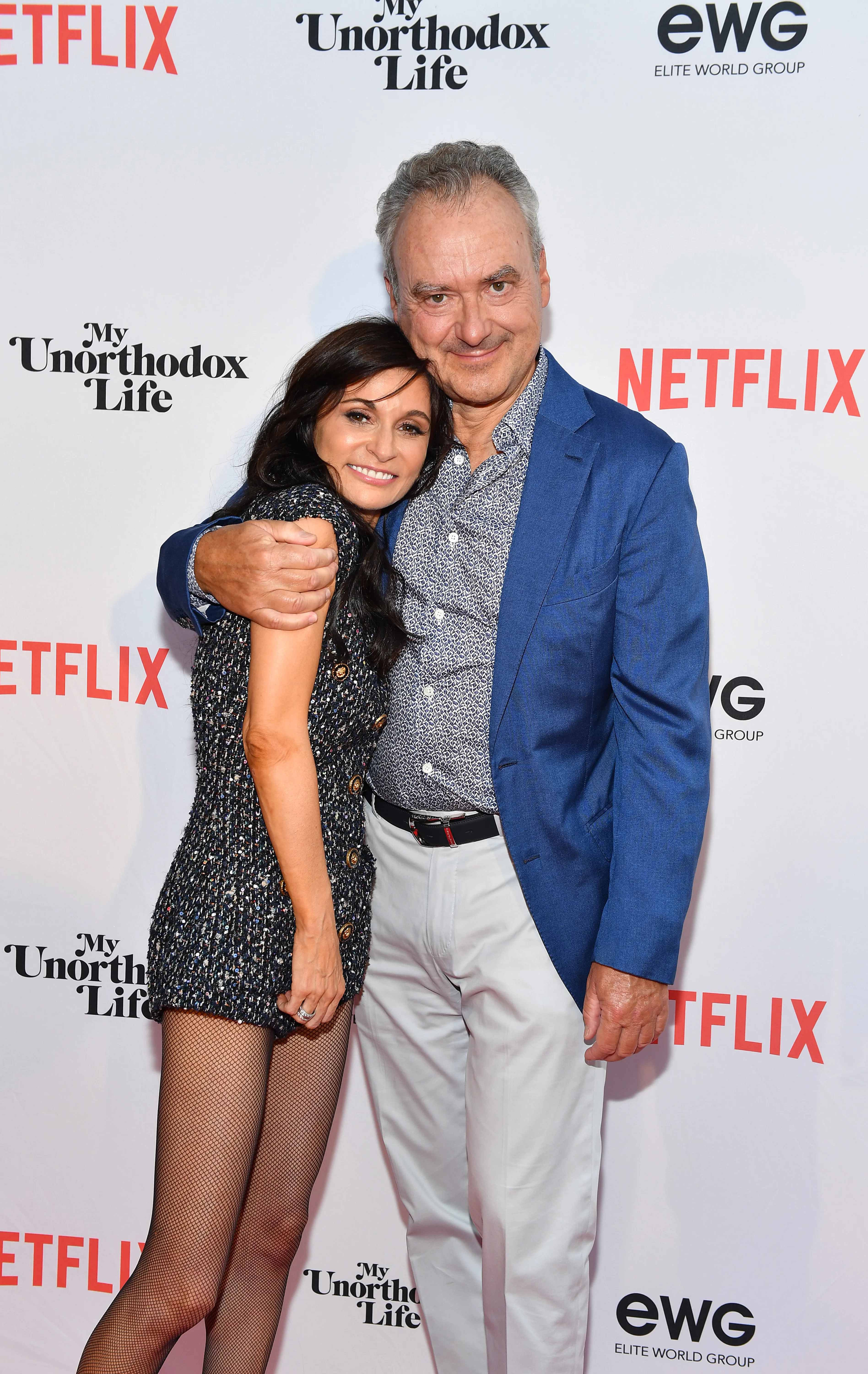 Julia Haart and Silvio Scaglia embracing at the premiere of Netflix