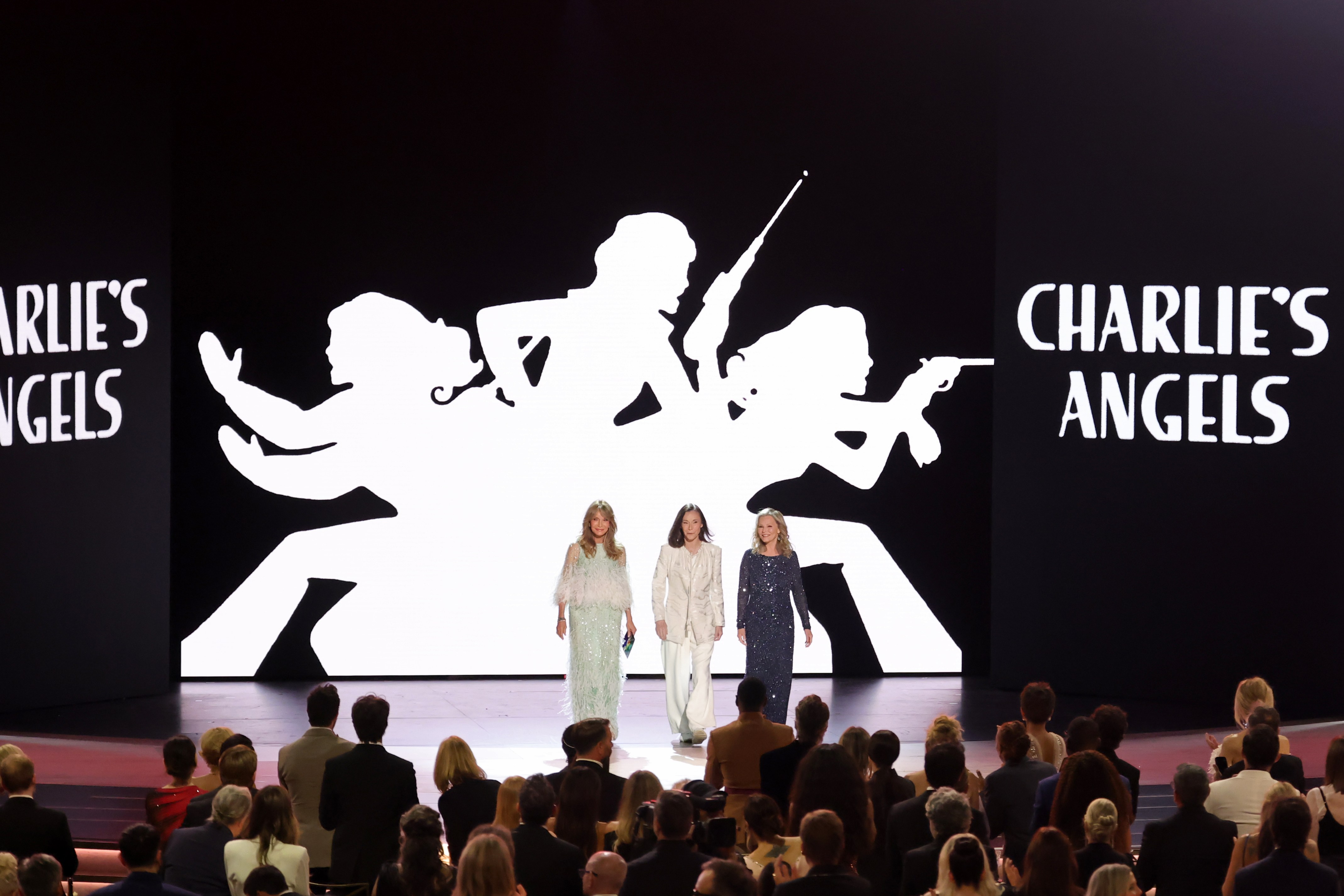 Jaclyn Smith, Kate Jackson, and Cheryl Ladd onstage at the 78th Primetime Emmy Awards with the "Charlie