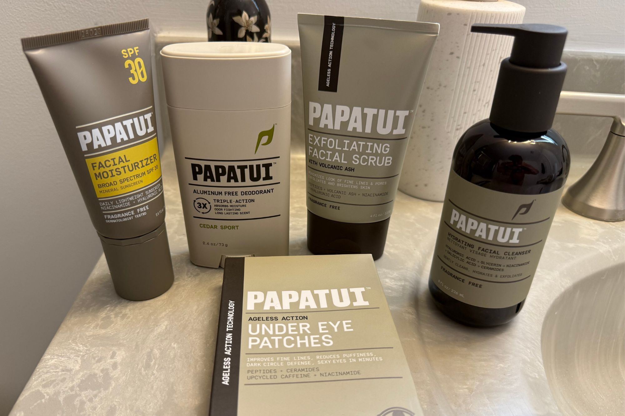 Papatui skincare products including facial moisturizer, deodorant, exfoliating facial scrub, under eye patches, and hydrating facial cleanser.