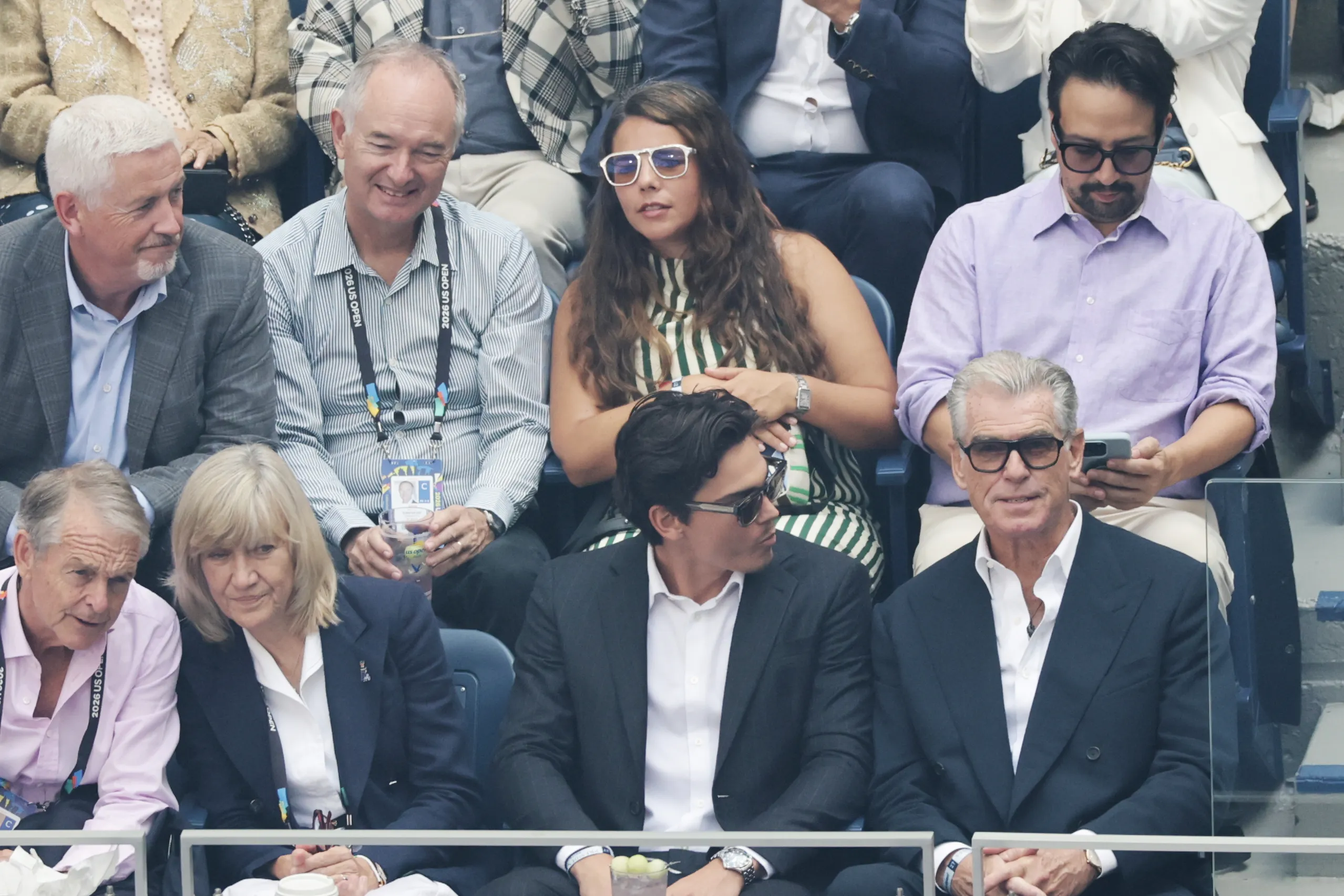 Lin-Manuel Miranda (top right) and Pierce Brosnan (bottom right) watching a tennis match.