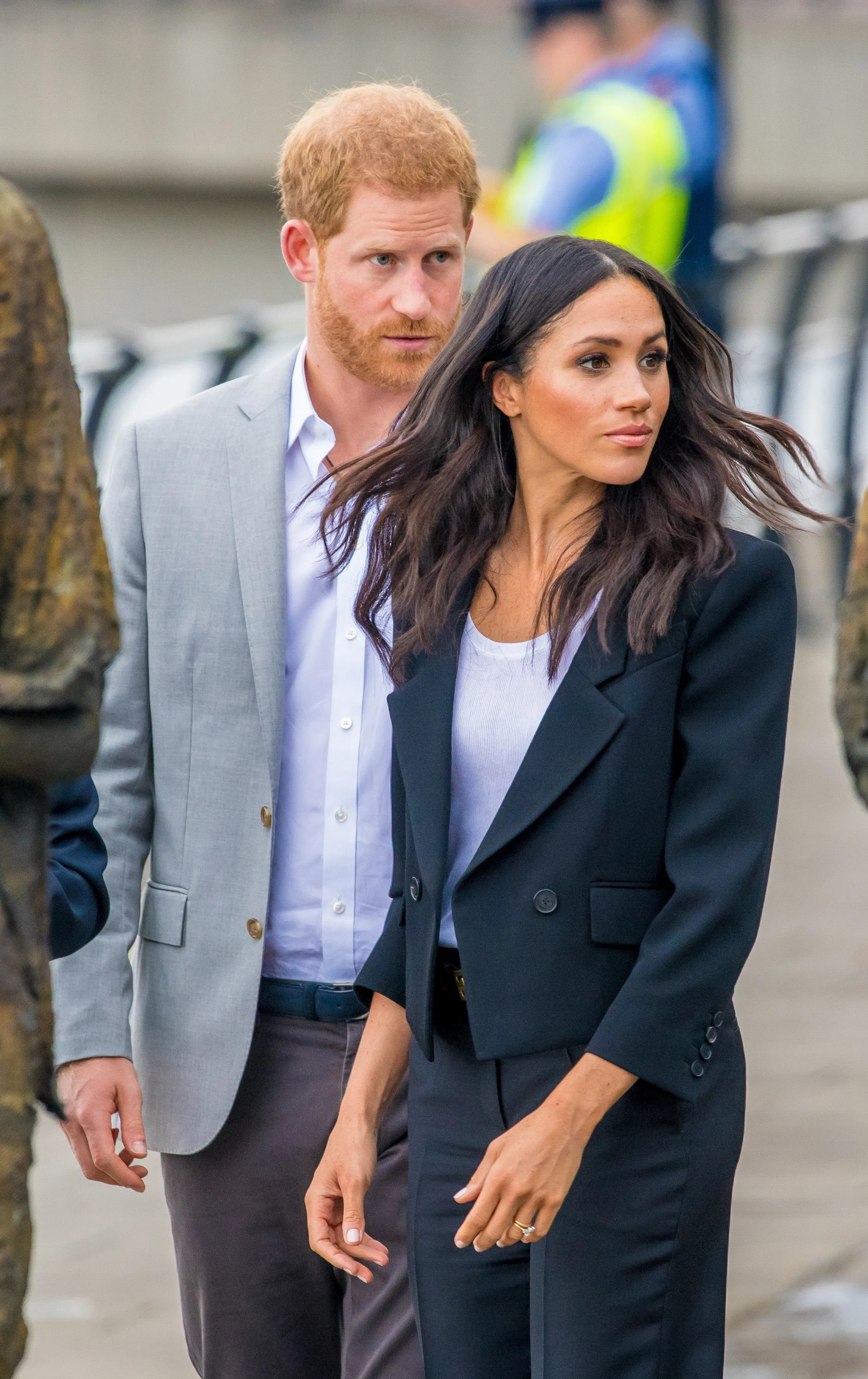 Prince Harry and Meghan Markle walking side-by-side.