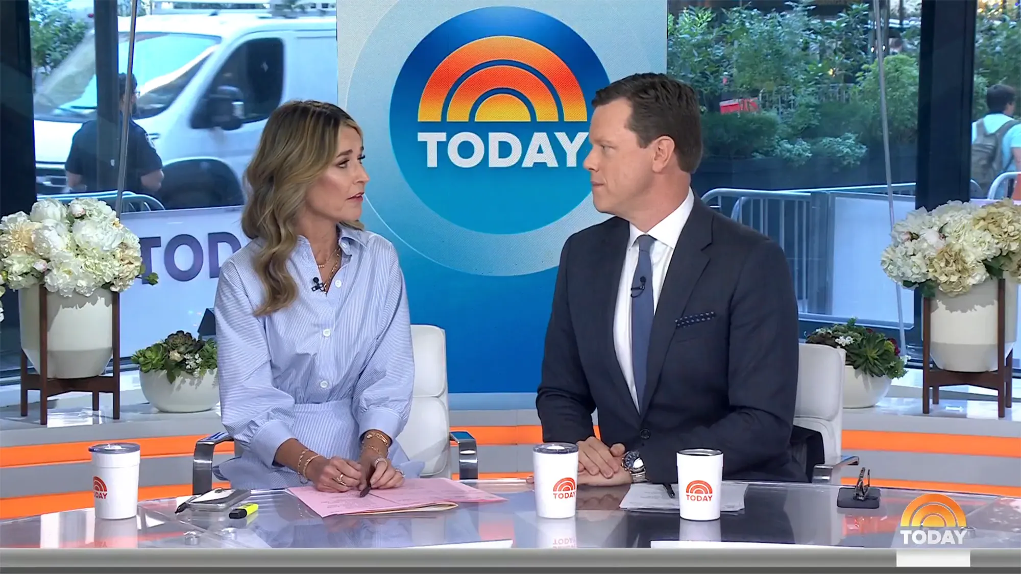 Savannah Guthrie and another Today show host sitting at a desk.