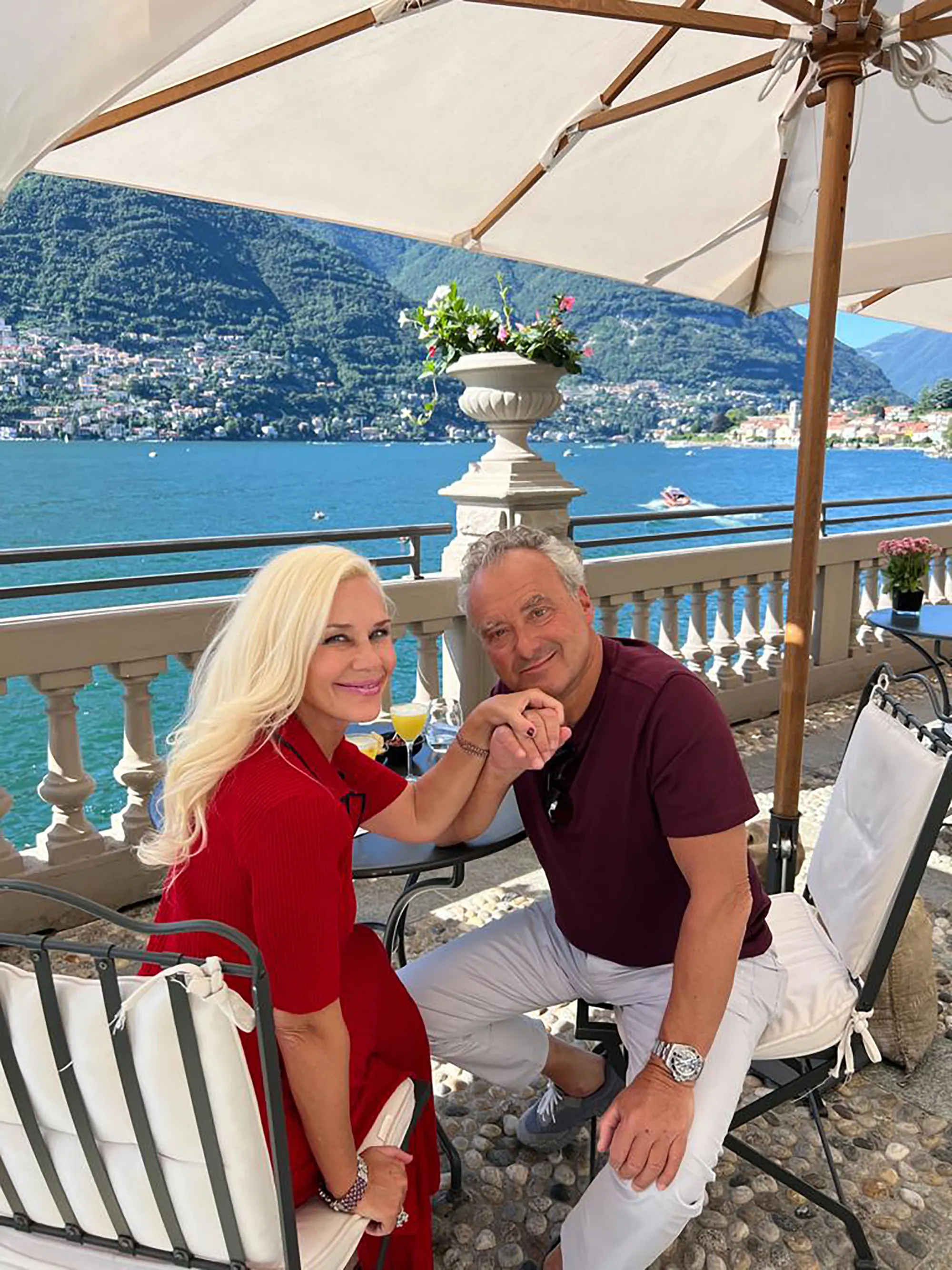 Michelle-Marie Heinemann and Silvio Scaglia holding hands.
