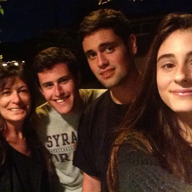 Michele, Nick, Jake, and Romy Reiner smiling together.