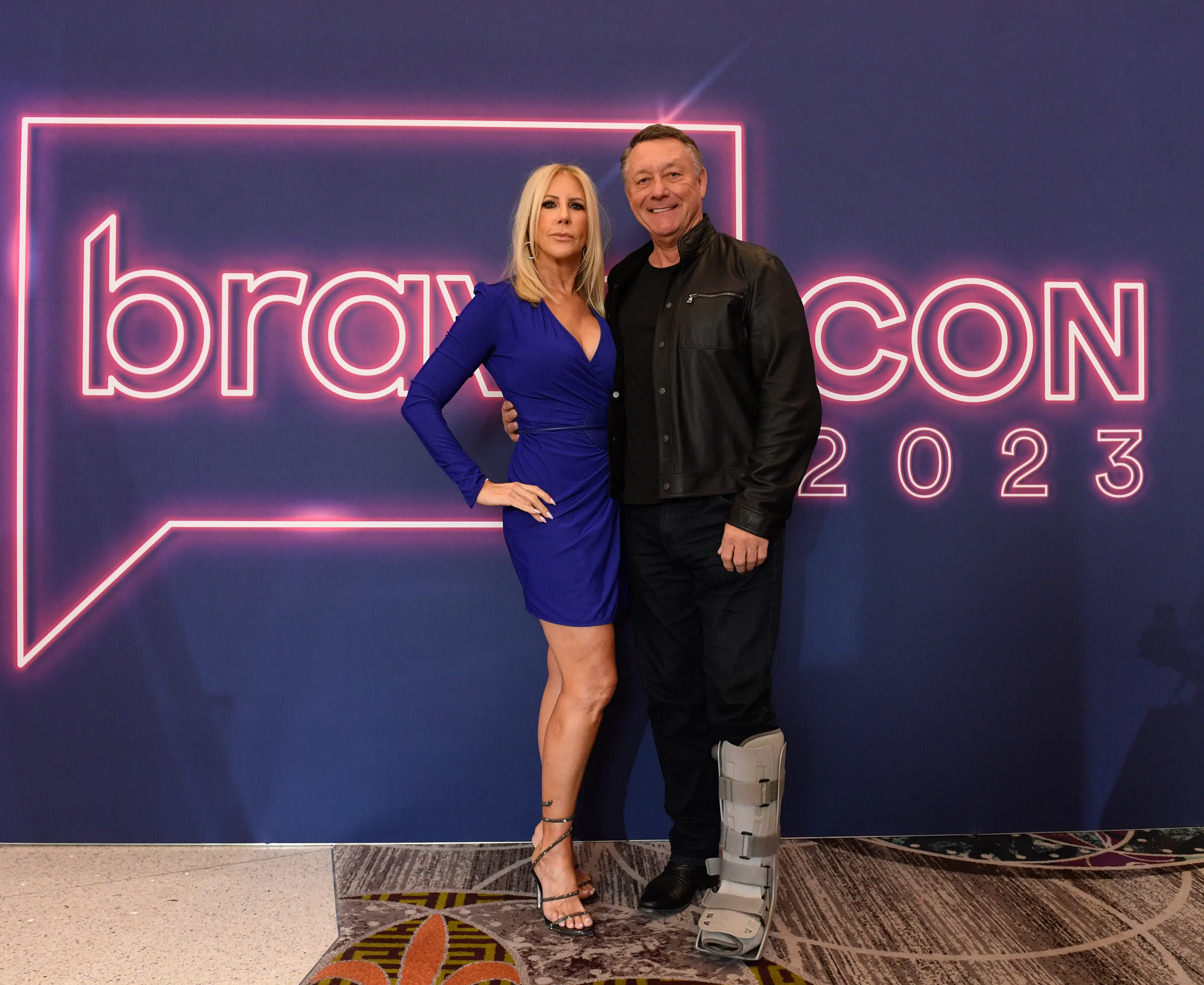 Vicki Gunvalson and Michael Smith smiling at BravoCon 2023.