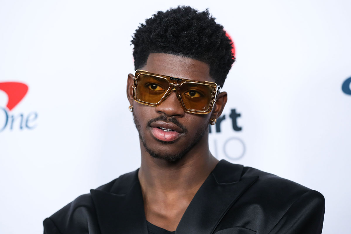 Lil Nas X posing at a high-profile entertainment event